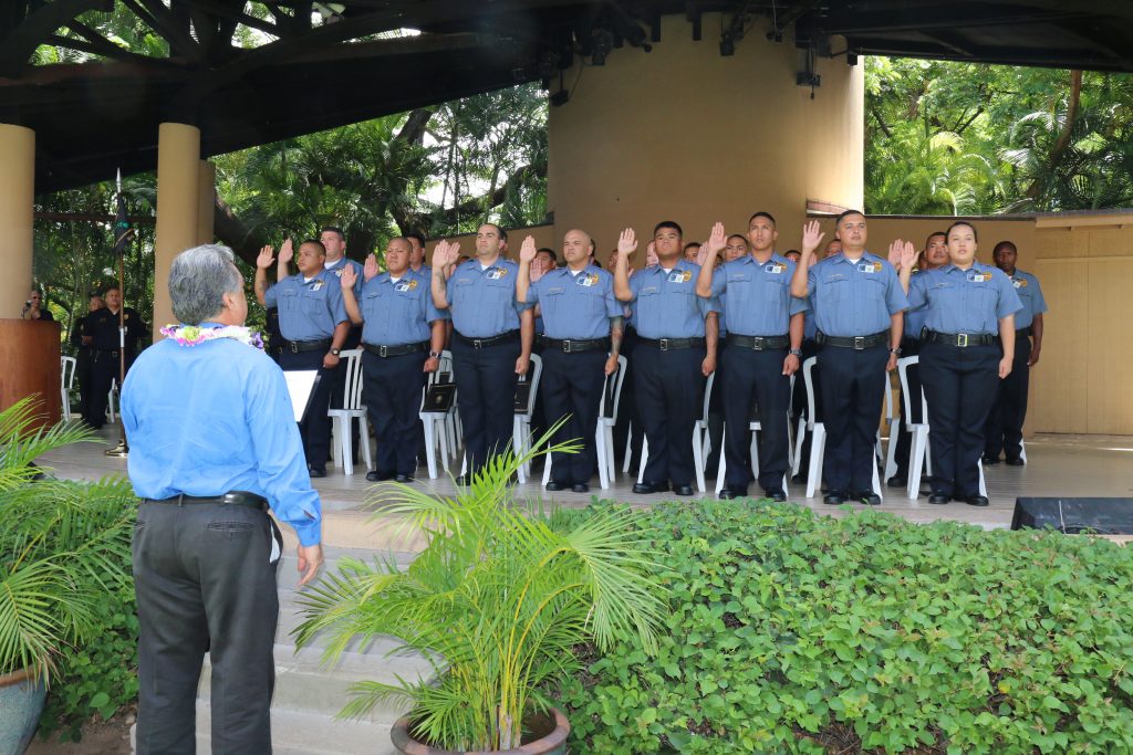 Recruits taking the oath of duty during their graduation ceremony. Photo: DPS.