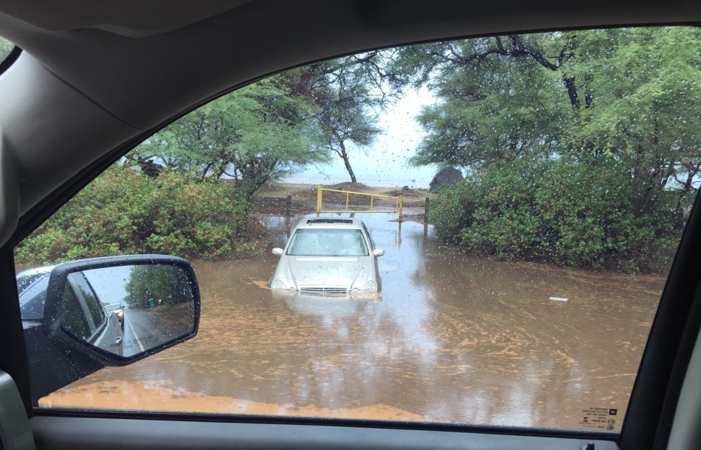 Vehicles stuck in flood waters along the Honoapiilani Highway in West Maui caused major delays in traffic as motorists slowed to look at the remnant flooding off the road. PC: 9.14.16 by Jared James