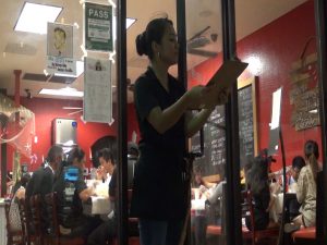 Co-owner and sibling Heizel Allado welcomes customers to Da Shrimp Hale at Maui Mall. Photo by Kiaora Bohlool.