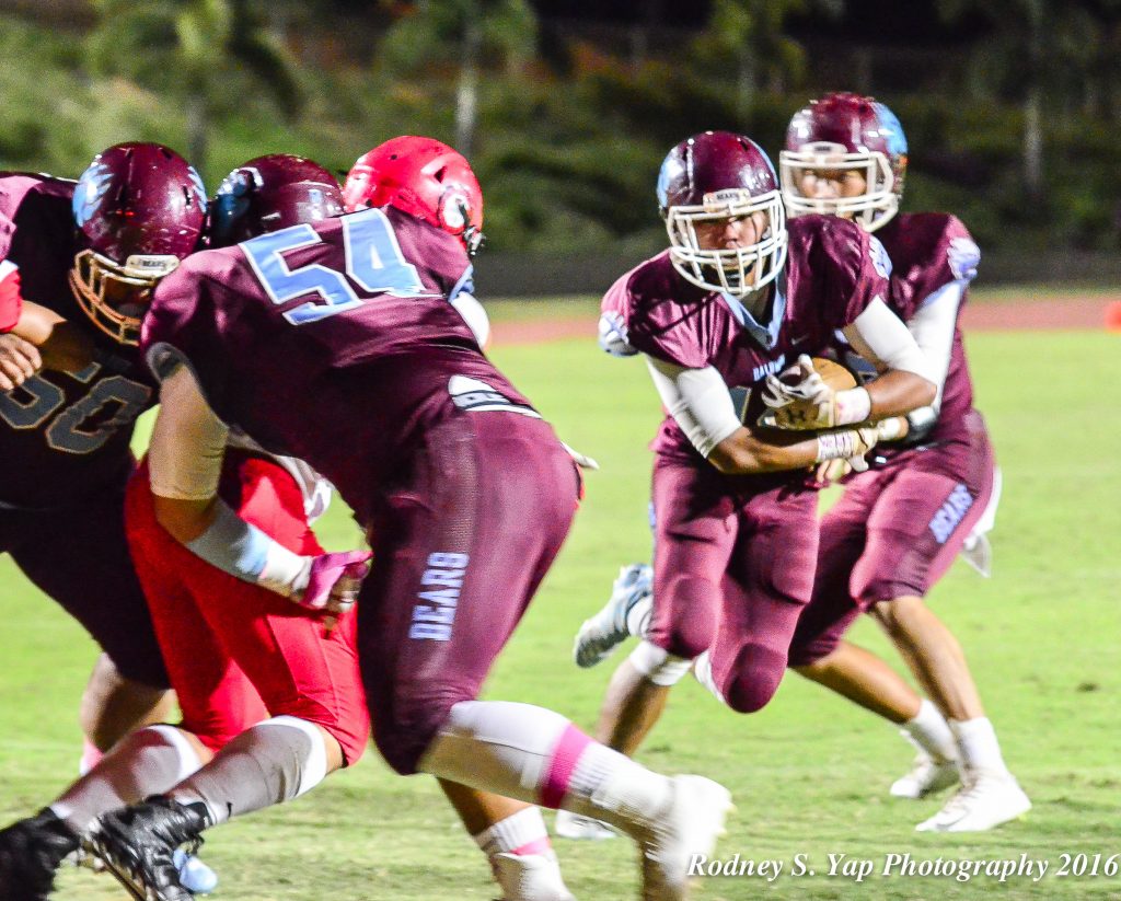 Baldwin's Daniel Corpuz runs behind the block of lineman Jared Paranada en route to a 1-yard touchdown run Saturday against Lahainaluna. Photo by Rodney S. Yap.