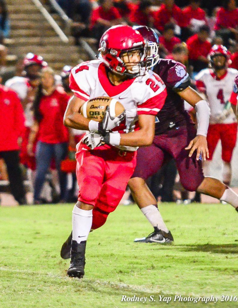 Lahainaluna's Elijah Ragudo sxored his team's only touchdown on a 43-yard run in the third quarter Saturday. Photo by Rodney S. Yap.
