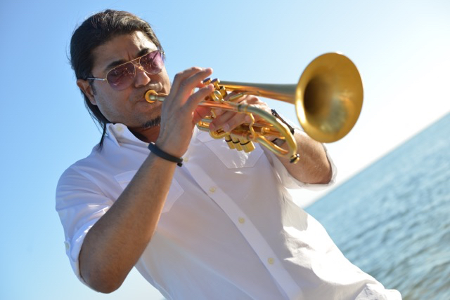 DeShannon Higa playing trumpet on the beach, courtesy photo. On November 5 is Jazz Maui’s 2016 East Meets West Festival concert, showcasing of some of Hawai‘i’s best jazz musicians along with highly talented Maui orchestras and student musical groups. Award-winning trumpet soloist, band leader and recording artist, DeShannon Higa is the featured performer and conductor of a jazz/improv workshop.