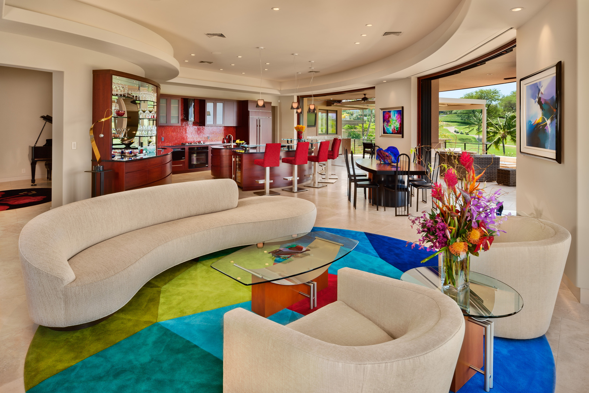 ADC, Inc.’s residence in Wailea makes a modern architectural statement from the home’s curved lines and architectural details to the seamless indoor-outdoor transition emphasized through floor-to-ceiling windows and open spaces. Photo by: Tropical Light Photography