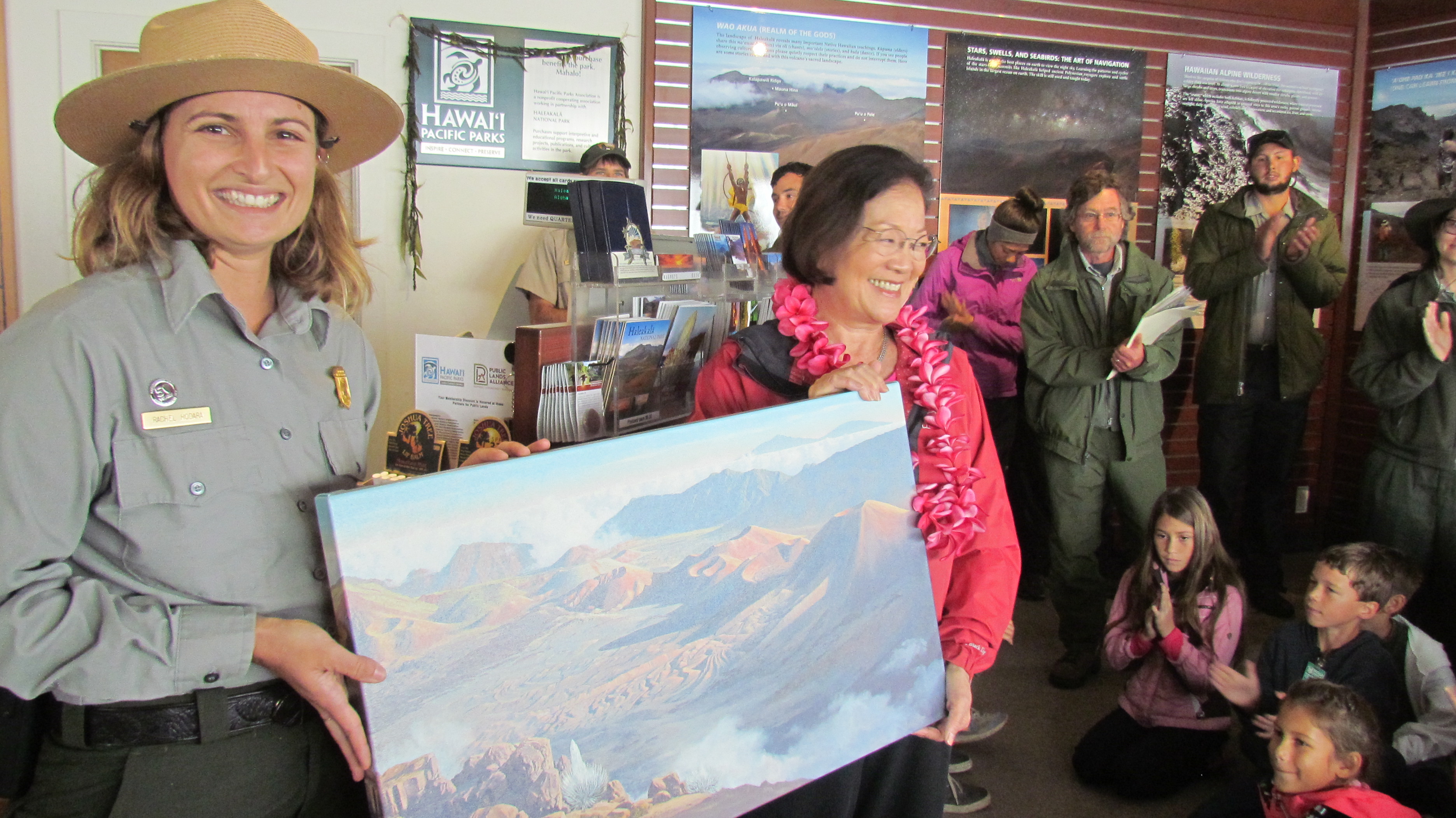 Staff present Hirono with painting.