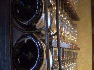 Bottles and glasses at MauiWine in ‘Ulupalakua. Photo by Kiaora Bohlool.