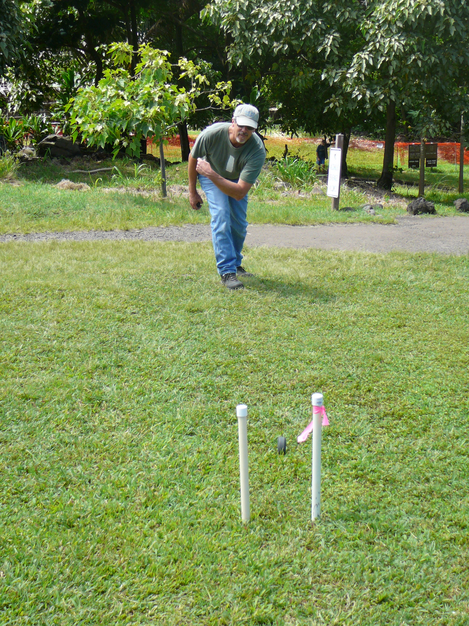 A visitor plays ulumaika (lawn bowling) at Kīpahulu. PC: Haleakalā National Park