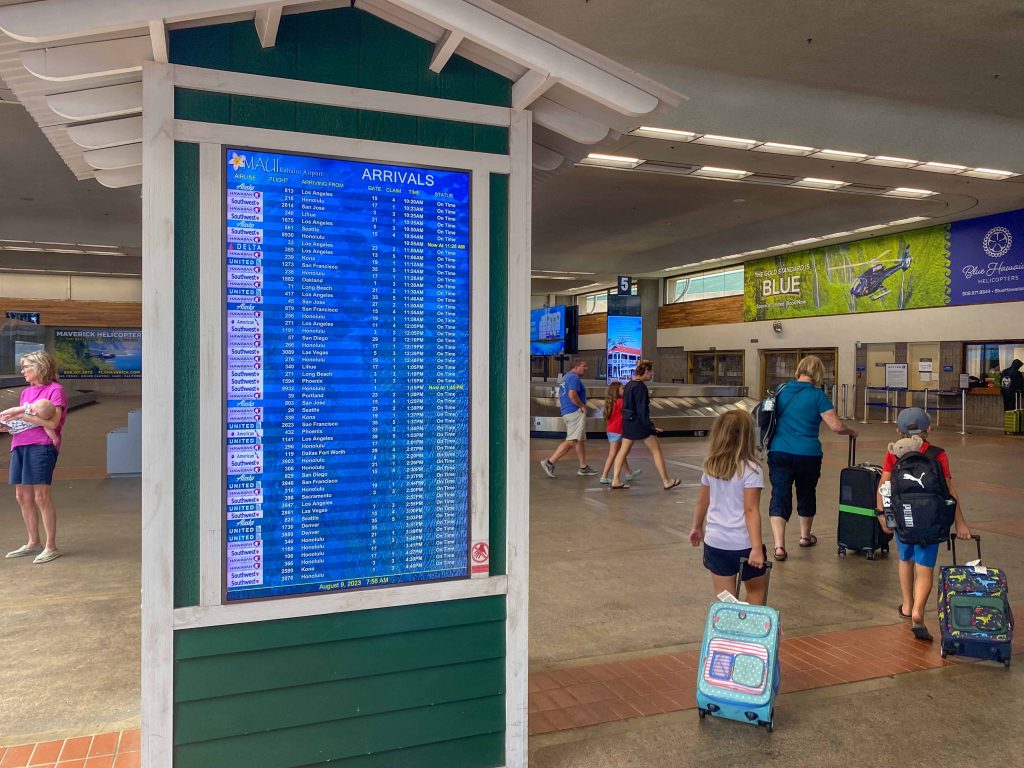 Kahului Airport busy with tourists leaving; one said Lahaina was like