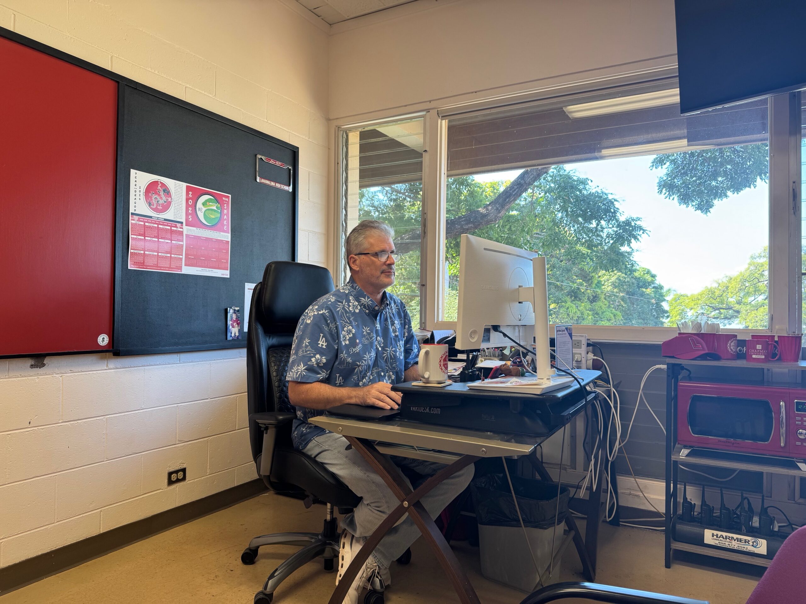 Richard Carosso, the principal at Lahainaluna High School, works in his office on Tuesday. HJI / ROB COLLIAS photo