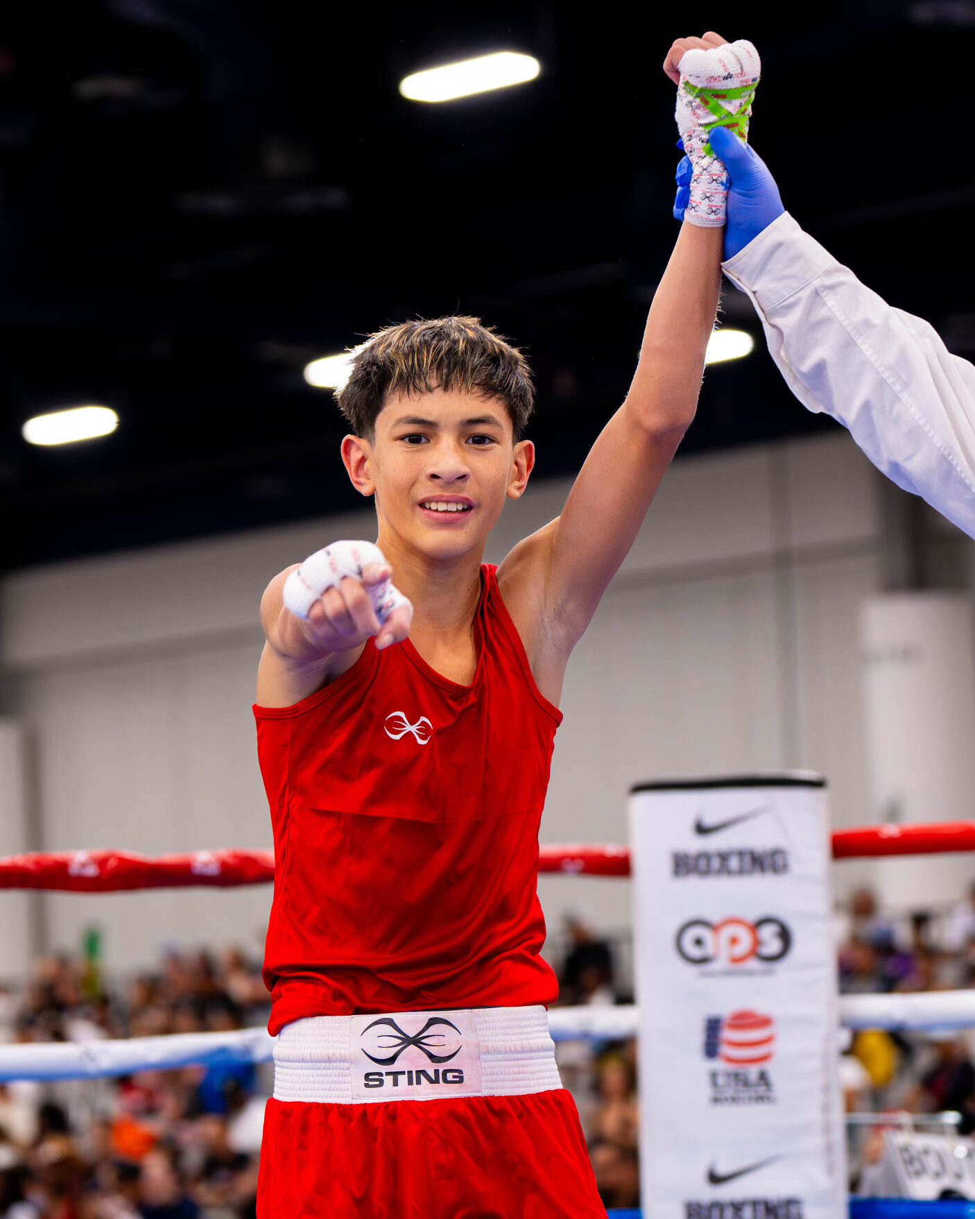Micah Diaz, a 13-year-old from rising eighth grader at Lokelani Intermediate School, has his hand raised in triumph after winning the USA Boxing Junior Olympics 90-pound intermediate division title in Las Vegas on June 20. USA Boxing photo