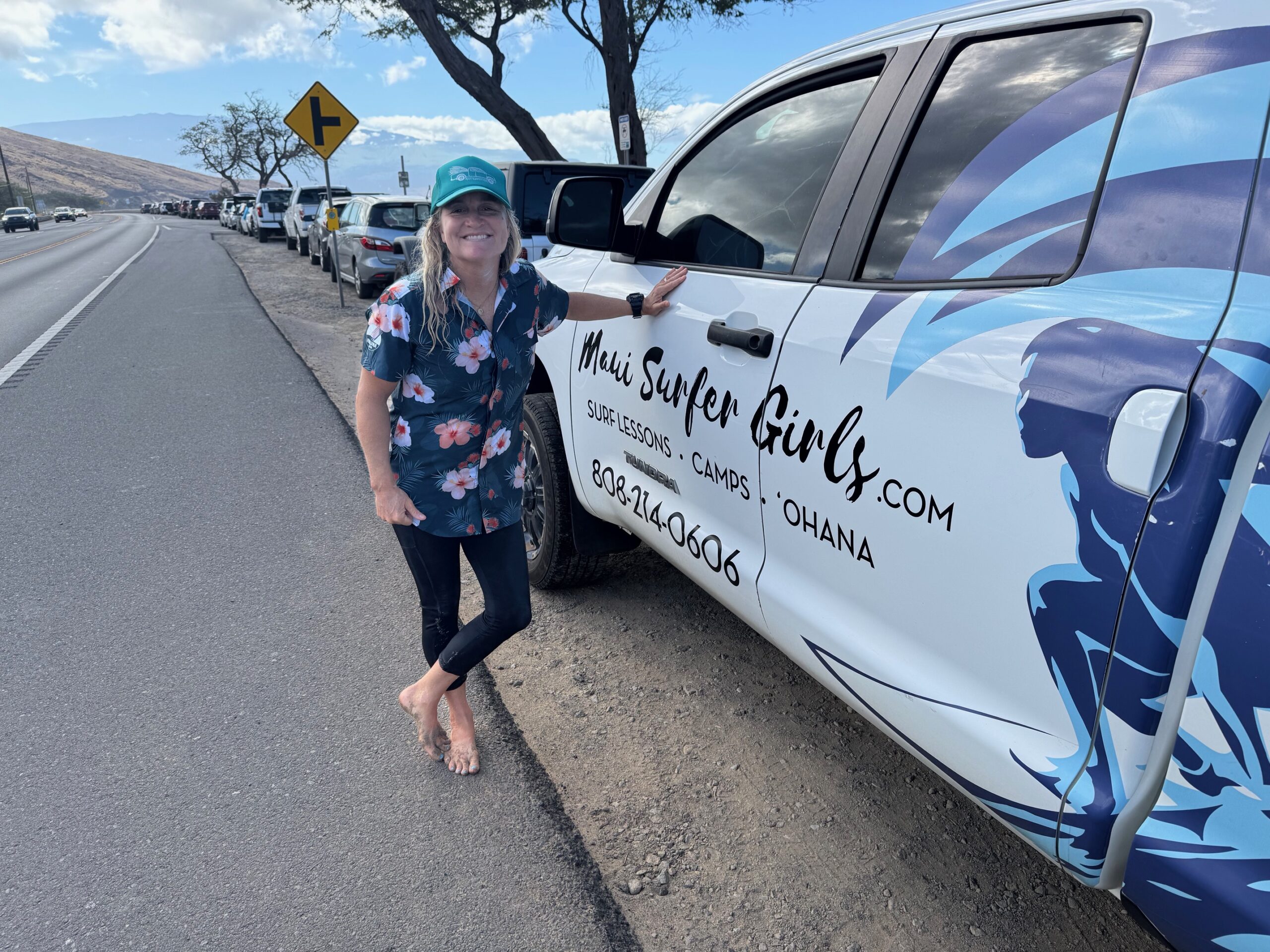 Maui Surfer Girls founder Dustin Tester stands next to the pickup truck that carries her equipment to Ukumehame Beach Park daily. HJI / ROB COLLIAS photo