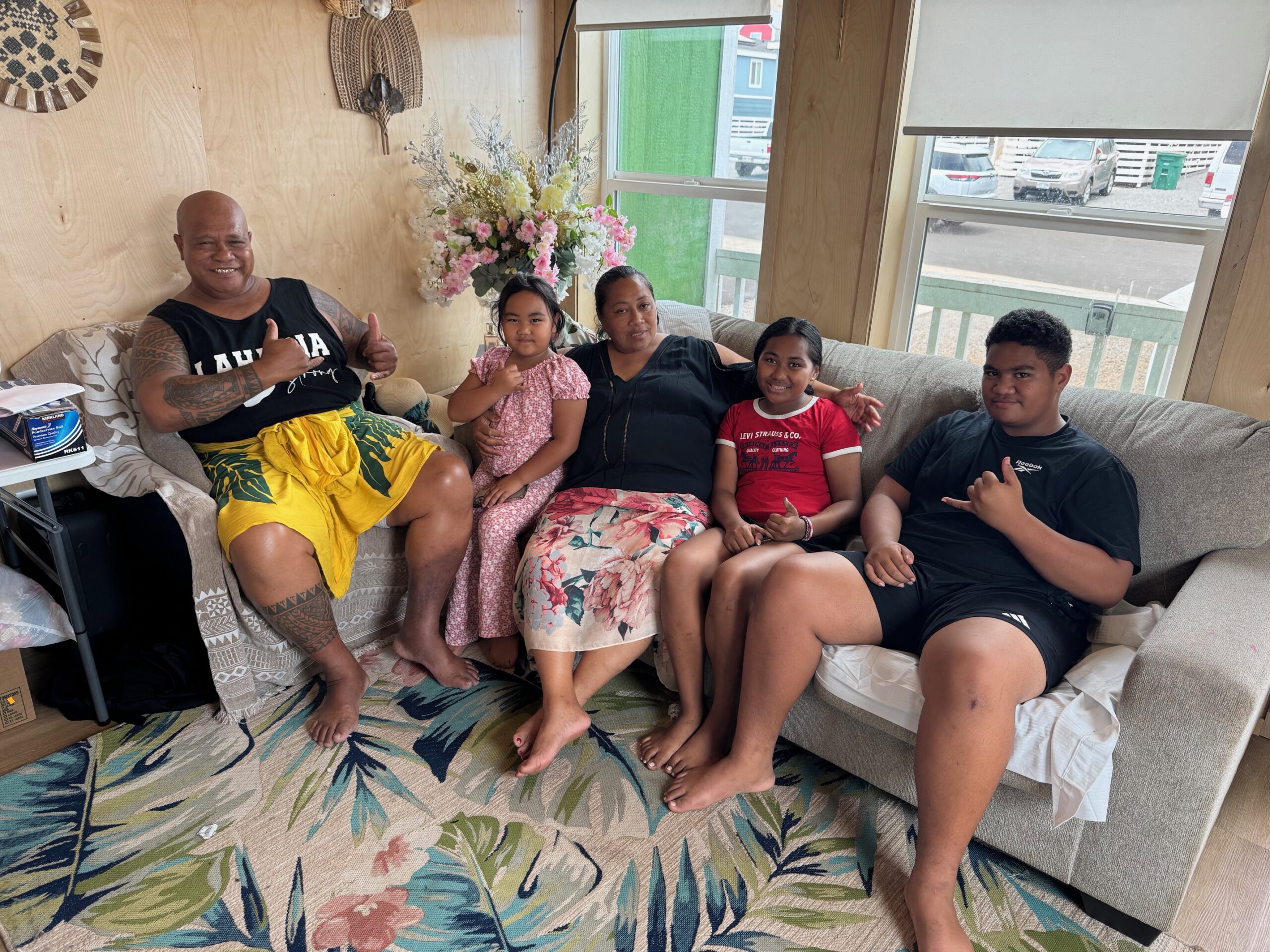The Folaumoeloa family sits in the living room of their 3-bedroom unit in Kilohana, a FEMA temporary housing complex in Lahaina. HJI / ROB COLLIAS photo