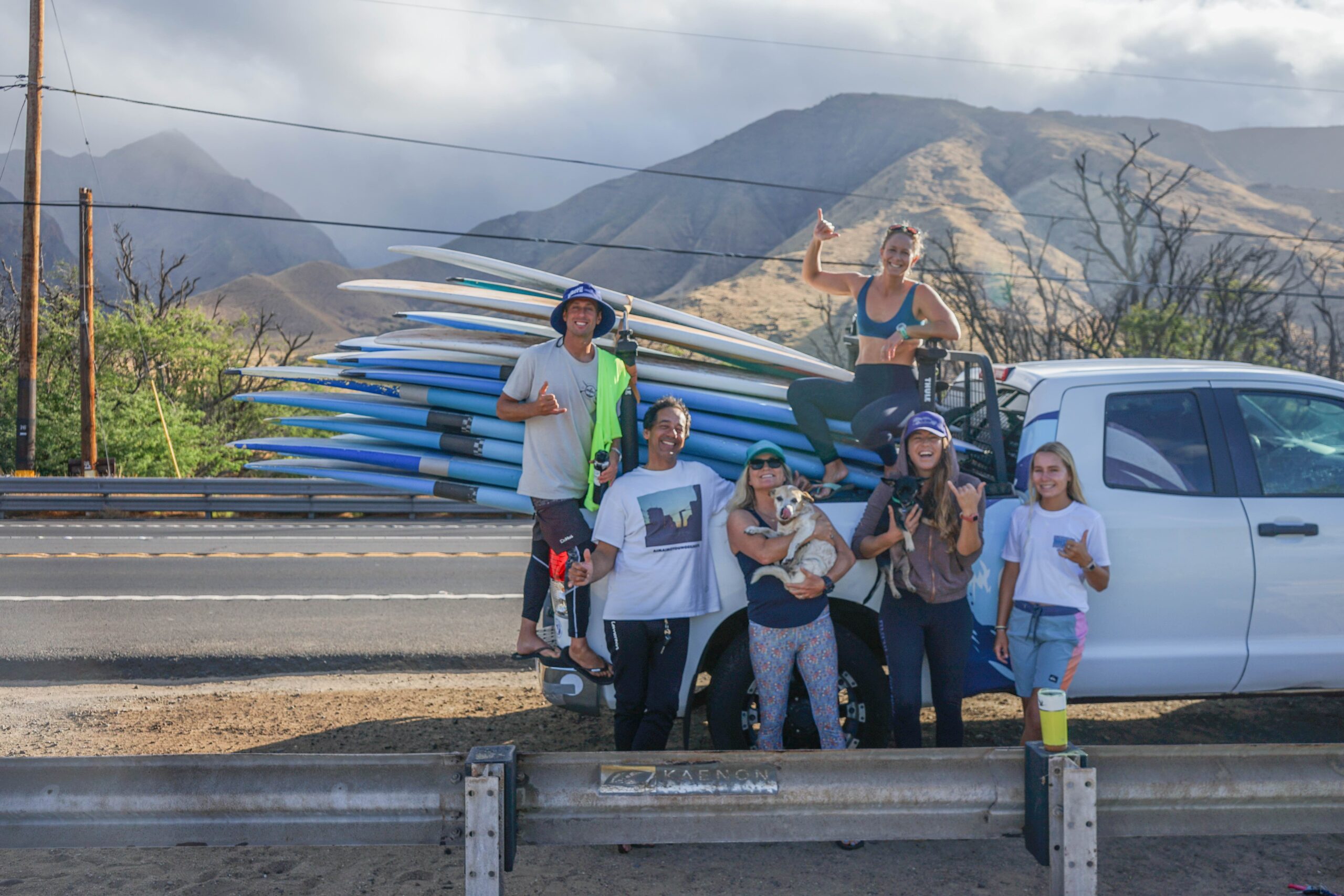 The staff of Maui Surfer Girls, founded by Dustin Tester (with dog) 25 years ago, takes a break recently at Ukumehame Beach Park. @rachaelzimmermanphotography photo