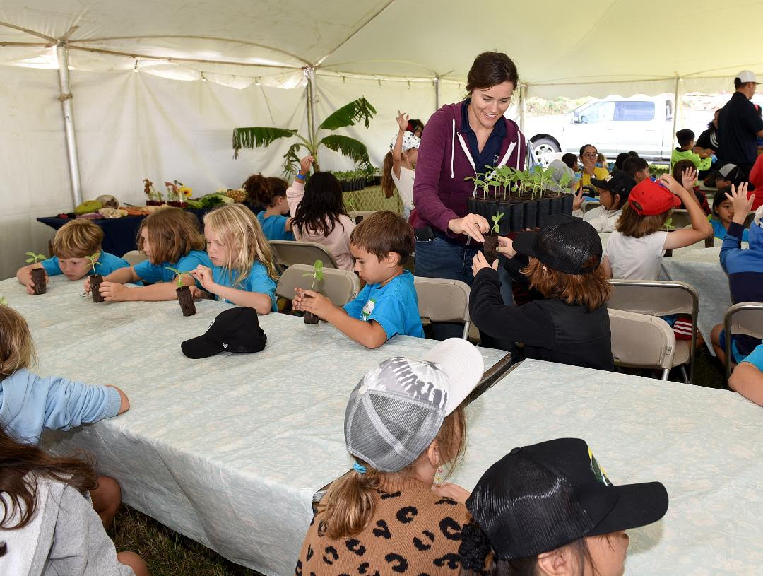 Second graders learn about the parts of a plant, things a plant needs to grow during a hands-on activity station at the April 11 Ag in the Classroom field trip sponsored by the Maui County Farm Bureau. Steve Brinkman photography