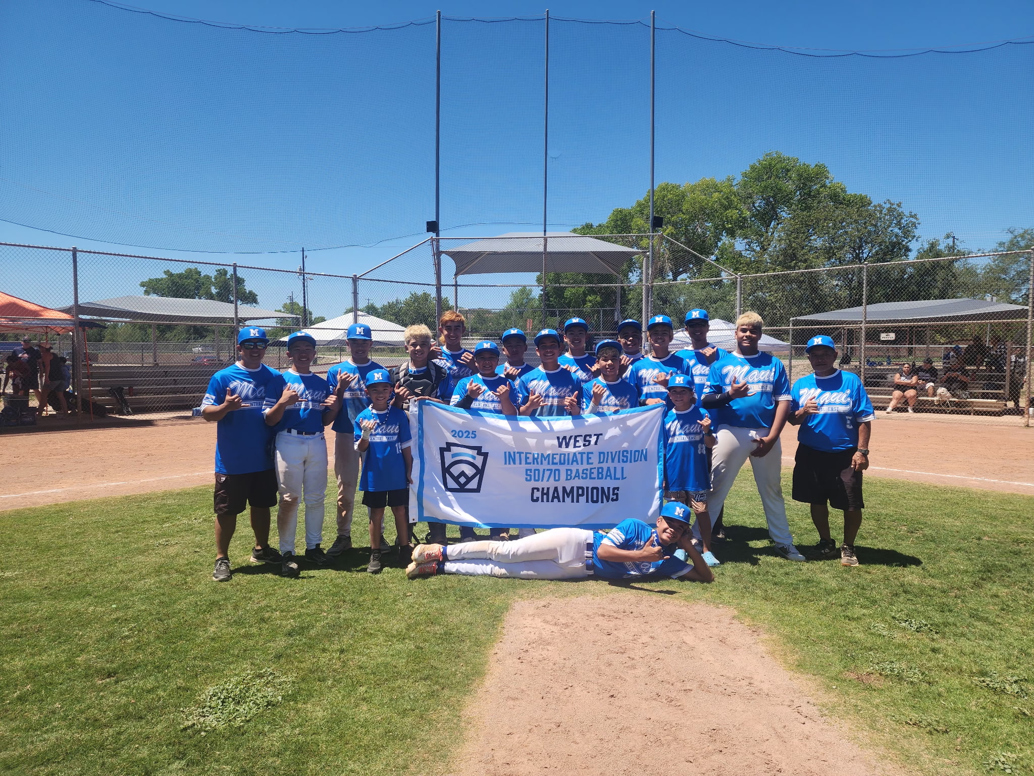 The Central East Maui Little League All-Stars display their championship banner from the West Region Intermediate 50/70 Division on Thursday in Nogales, Ariz. The victory advanced the Maui team to the Intermediate World Series in Livermore, Calif., that runs through Aug. 3. Courtesy photo