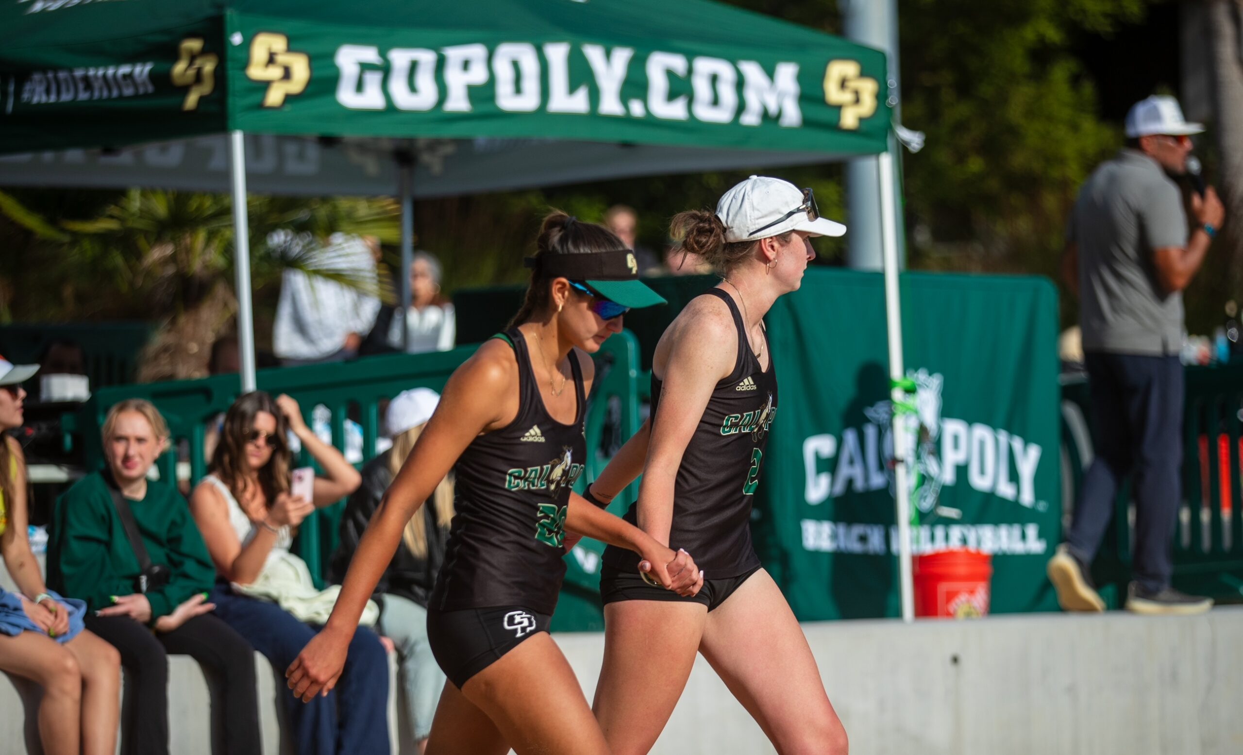 Ella Connor (right) and Izzy Martinez approach the court in a match in 2024 for Cal Poly. The pair played No. 1 for the Mustangs most of the season. Courtesy photo