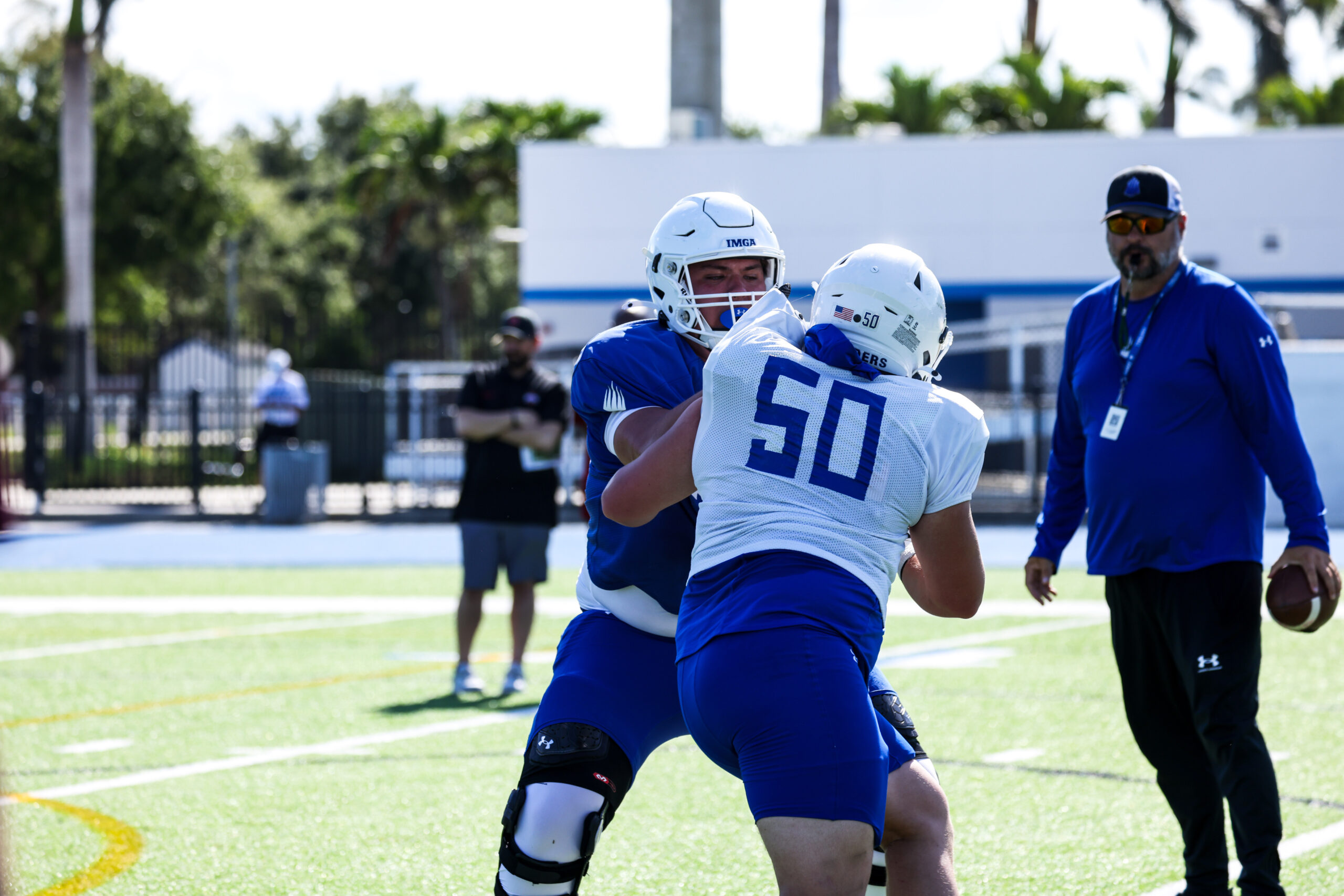 Kaholi Krau (left) works at practice for IMG Academy, where he played the last three seasons. The 6-foot-6, 320-pound 18-year-old offensive lineman returned home to Maui on Sunday and will play for Baldwin High School this fall. Courtesy photo