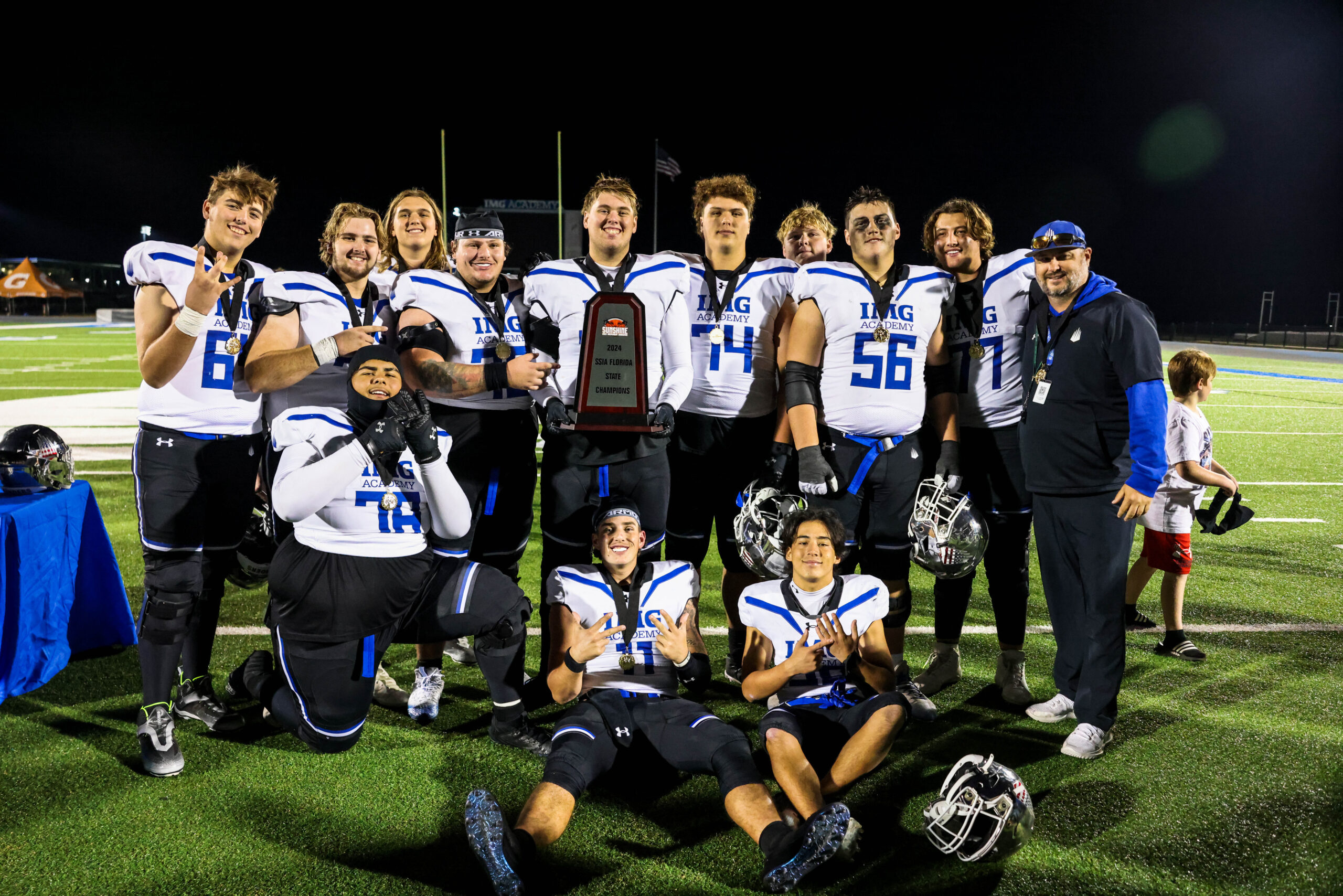 Kaholi Krau (middle, 74) wears his state championship medal for IMG Academy in 2024. Krau has returned home to play for Baldwin High School after three years at IMG in Bradenton, Fla. Courtesy photo