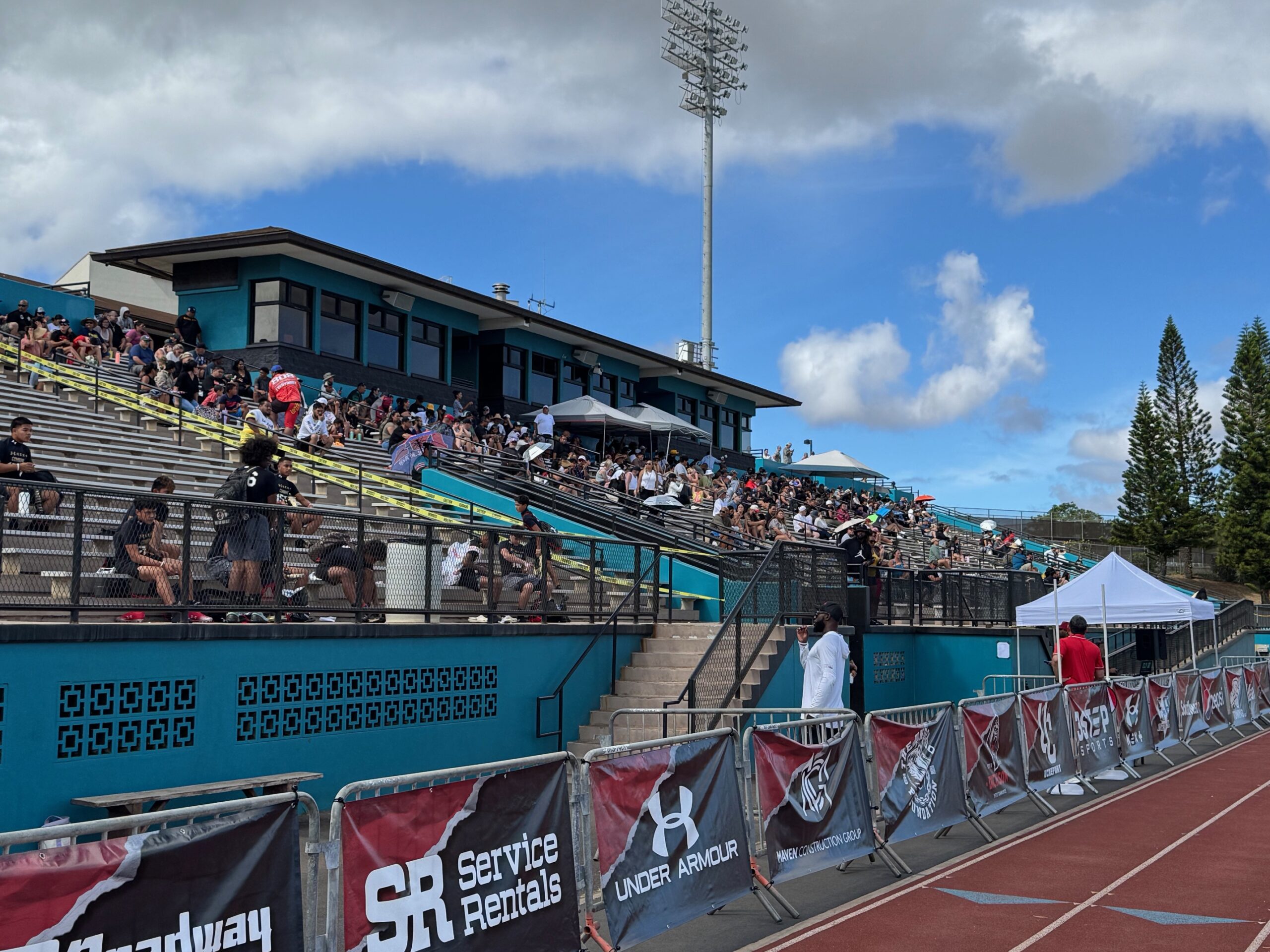A crowd that grew to 1,200 fills in at King Kekaulike Stadium on Saturday for the Under Armour Next Camp. HJI / ROB COLLIAS photo