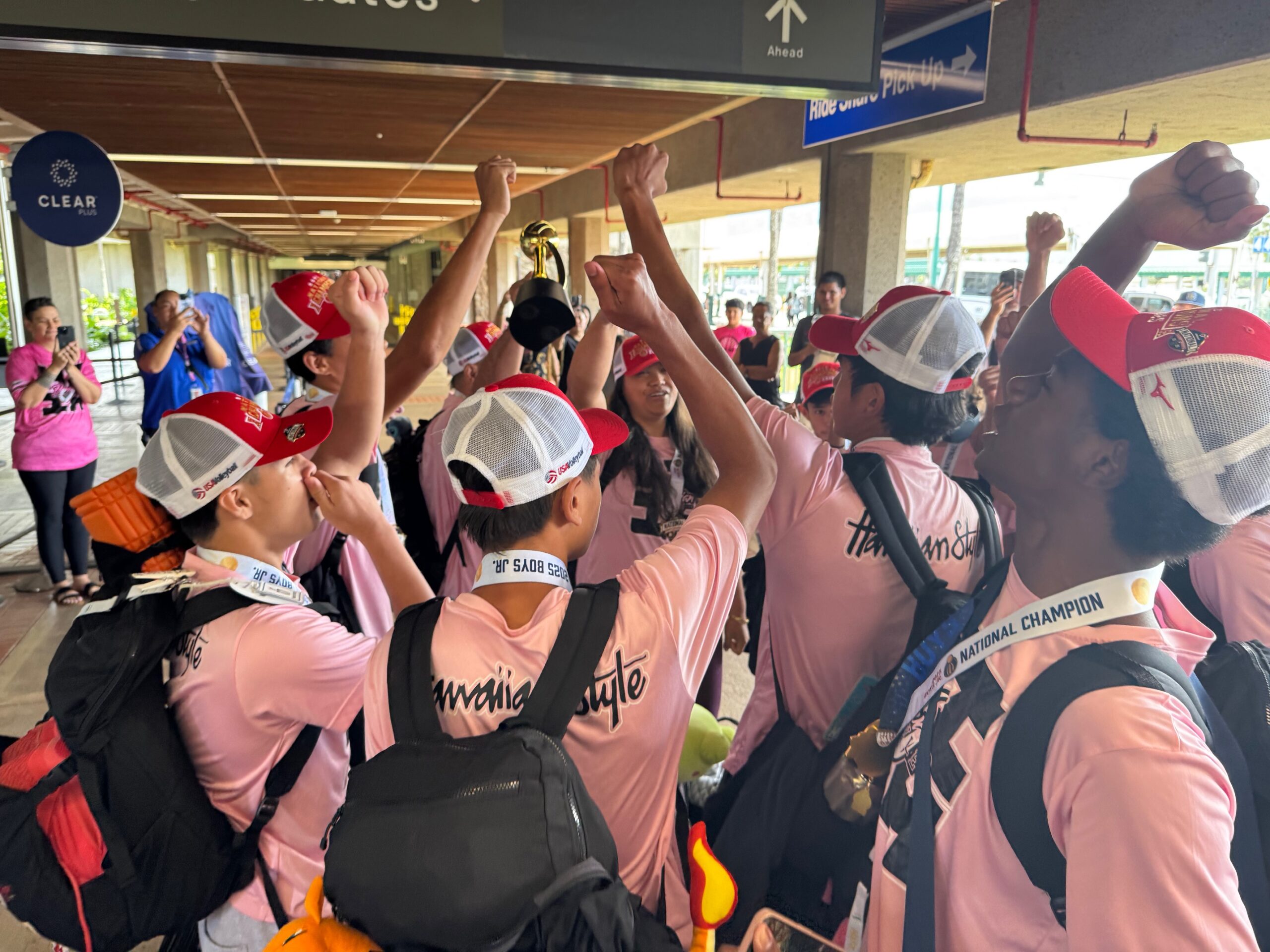 The Hawaiian Style Volleyball Club boys 15 USA Volleyball national champions do a team cheer at Kahului Airport on Monday. HJI / ROB COLLIAS photo