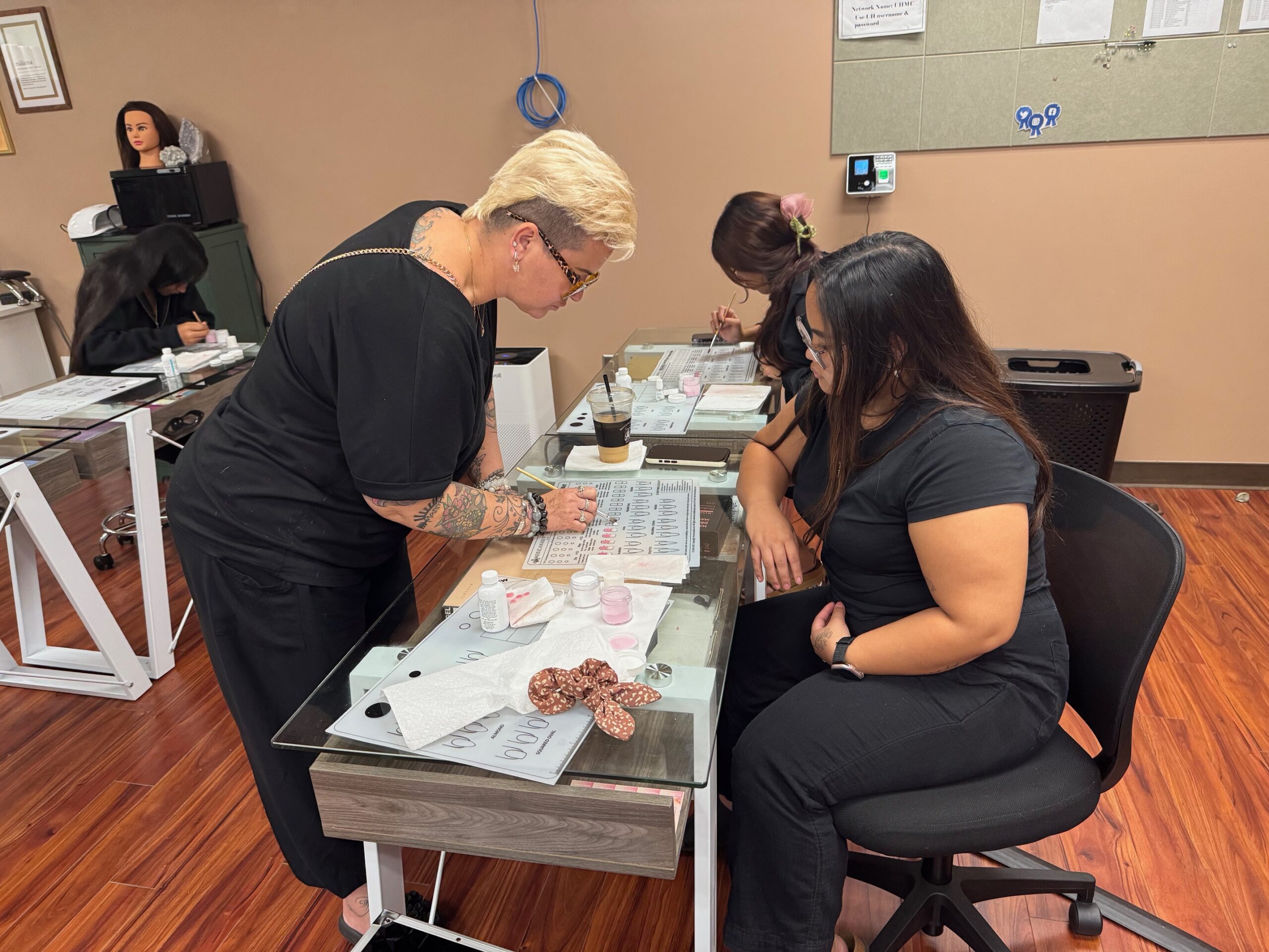 Instructor Reese Yap works on nail technology one-on-one with Jaelyn Corpuz in the Beauty Operator Program at the University of Hawai'i Maui College. HJI / ROB COLLIAS photo