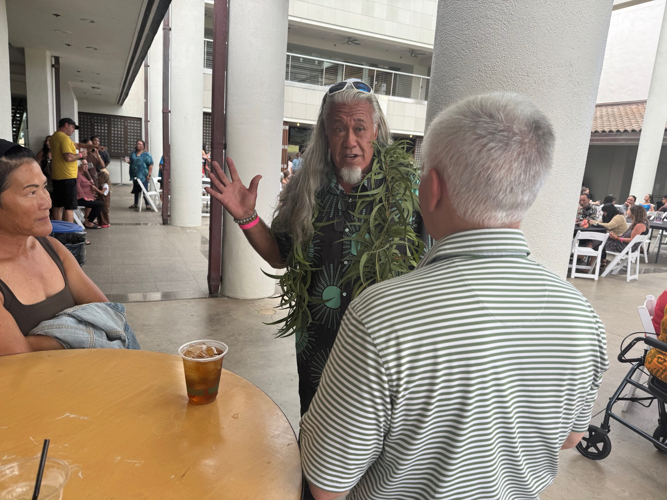 Branscombe Richmond (middle) speaks with Everett Dowling (right) and Mei Lee Dowling on Sunday at an invite-only event for the premier episode 1 of "Chief of War" on Sunday at the Maui Arts & Cultural Center. HJI / ROB COLLIAS photo