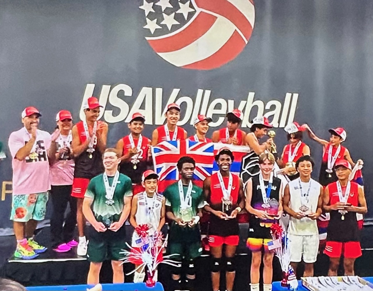 The Hawaiian Style Volleyball Club's boys 15 team poses with their medals and trophy in Minneapolis, Minn., on Saturday after they won the USA Volleyball national championship at the top level for their age group. USA Volleyball photo