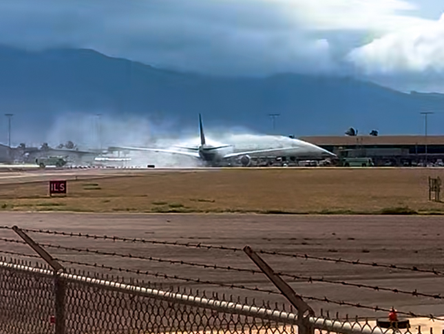 United flight 1736 from Denver received a fire truck water reception as it pulls into Gate 1 at Kahului Airport on Monday with the USA Volleyball boys 15-under national champions from Maui aboard. (Video screenshot)
