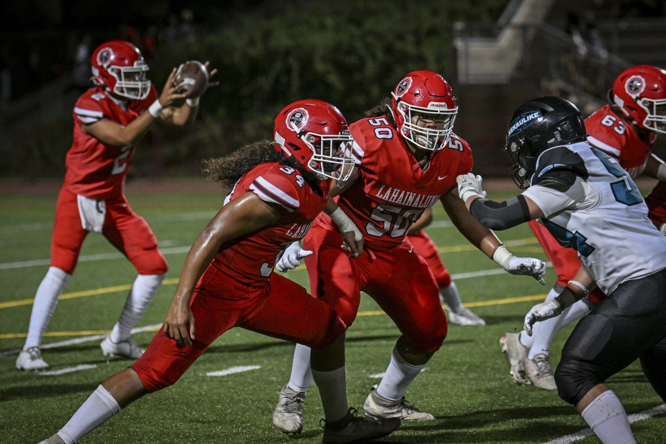David Sola Kauvaka (50) led the Lahainaluna High School running game to 480 yards on Friday night in the Lunas' 48-21 win over King Kekaulike on Friday. GLEN PASCUAL photo