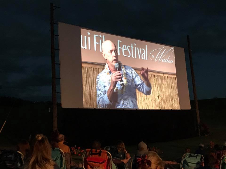 Brian Kohne, the current Maui Film Commissioner, talks on screen at the 2017 Maui Film Festival about his movie "Kuleana" under the stars in Wailea. Courtesy photo