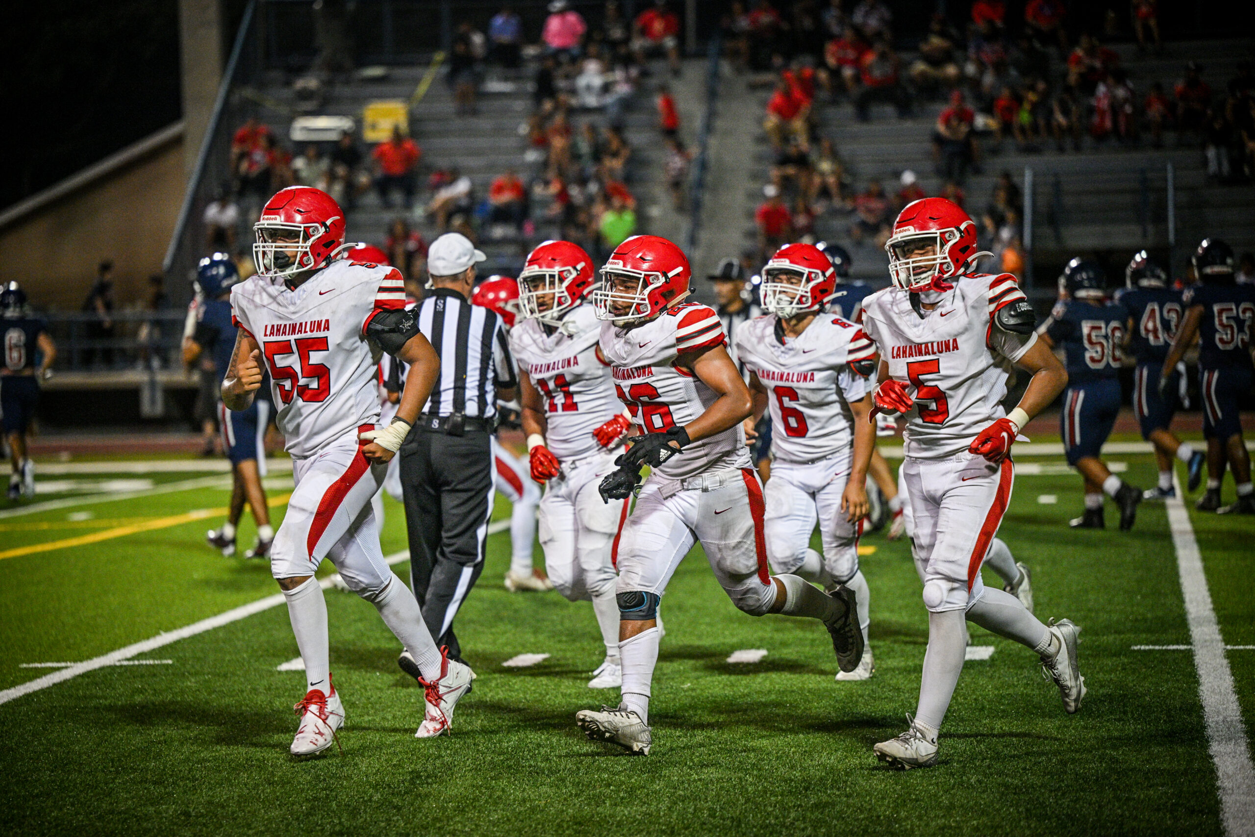 Lahainaluna High School football players run off the field in Waianae on Saturday. The Lunas lost to the Seariders 41-21 to open the season for both teams. GLEN PASCUAL photo