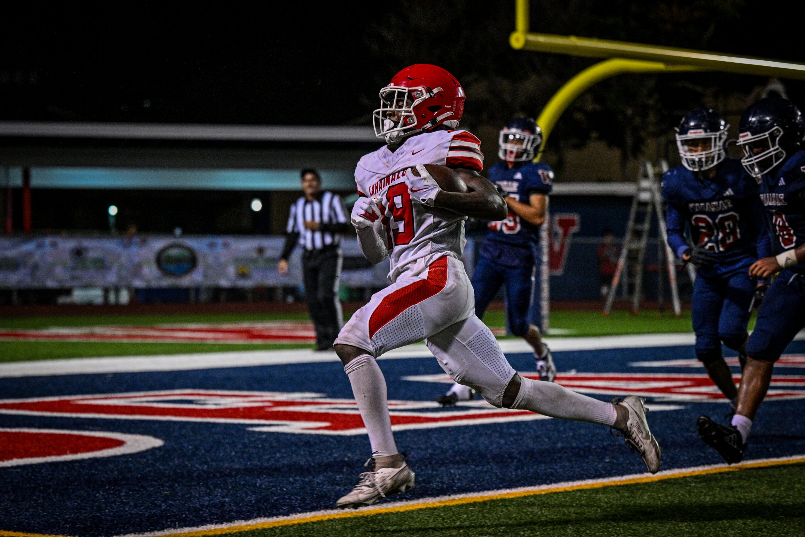 Lahainaluna High School junior Kyle Thomas enters the end zone to finish an 80-yard kickoff return for a touchdown against Waianae on Saturday night on O'ahu. GLEN PASCUAL photo