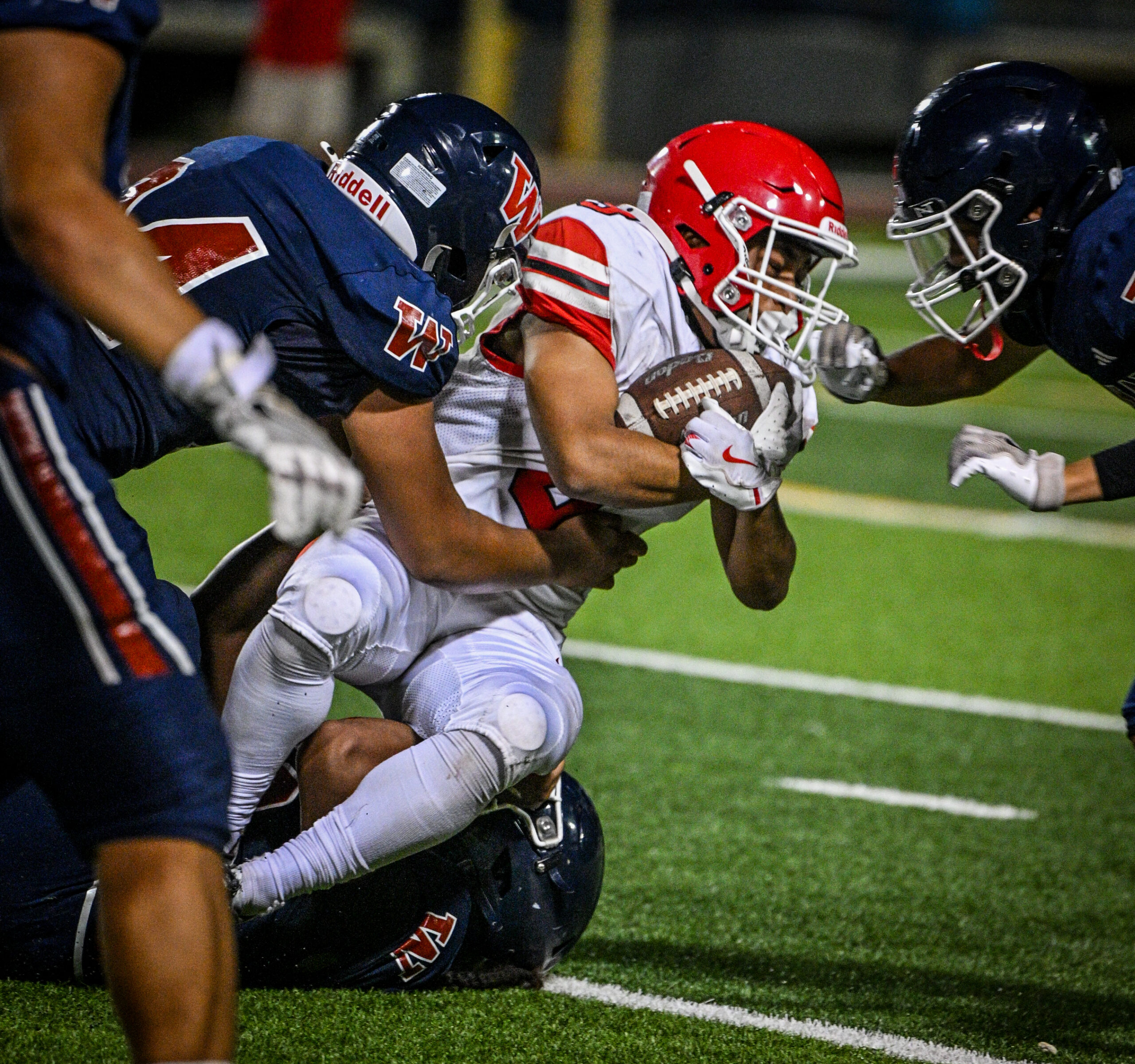 Lahainaluna High School's Joseph Arcangel is tackled by Waianae defenders in the Lunas' 41-21 loss on Saturday. GLEN PASCUAL photo