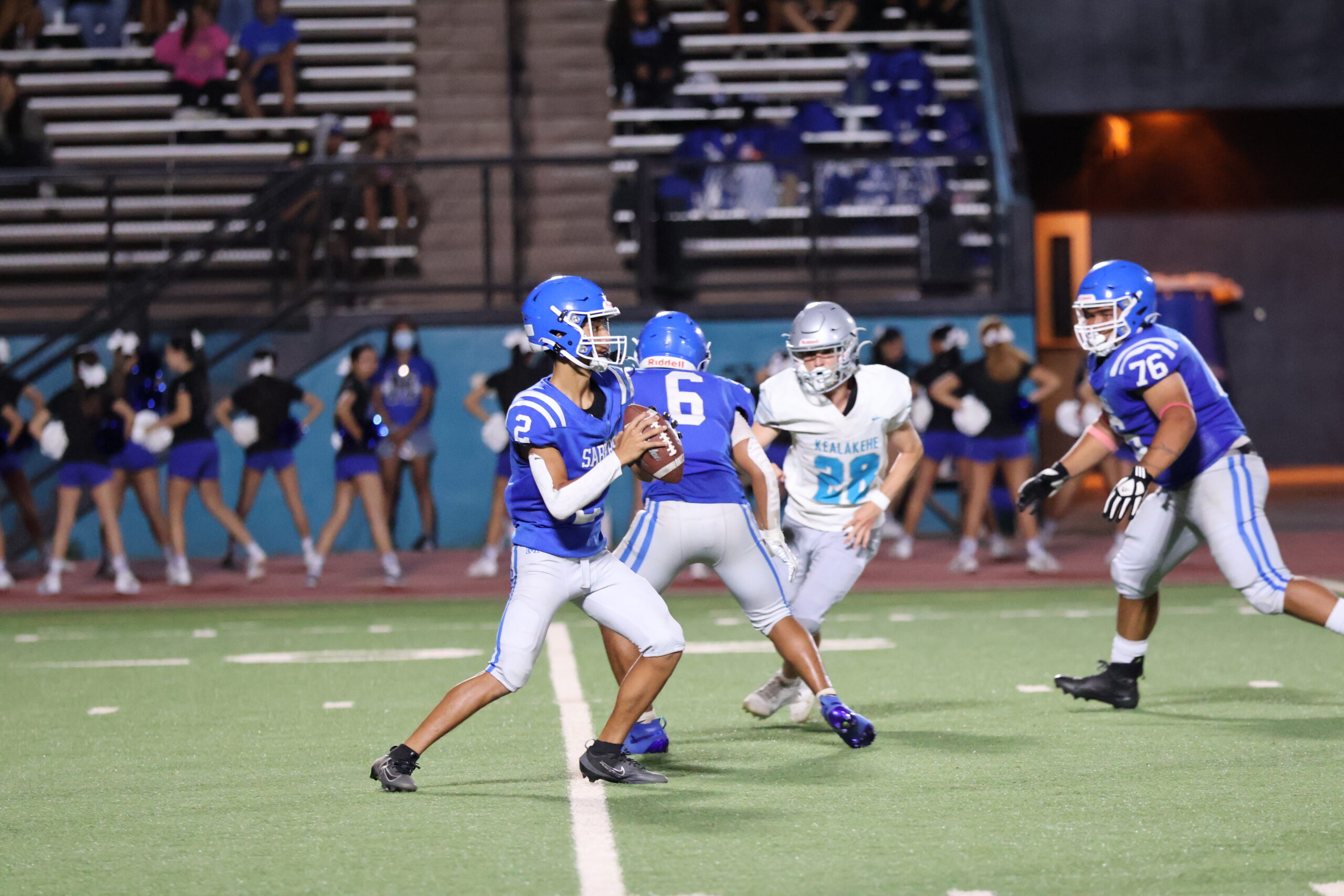 Maui High School quarterback Kahlen Boteilho-Dougherty drops back for a pass in the Sabers' 21-6 win over Kealakehe on Saturday at King Kekaulike Stadium. REID YAMAMOTO photo