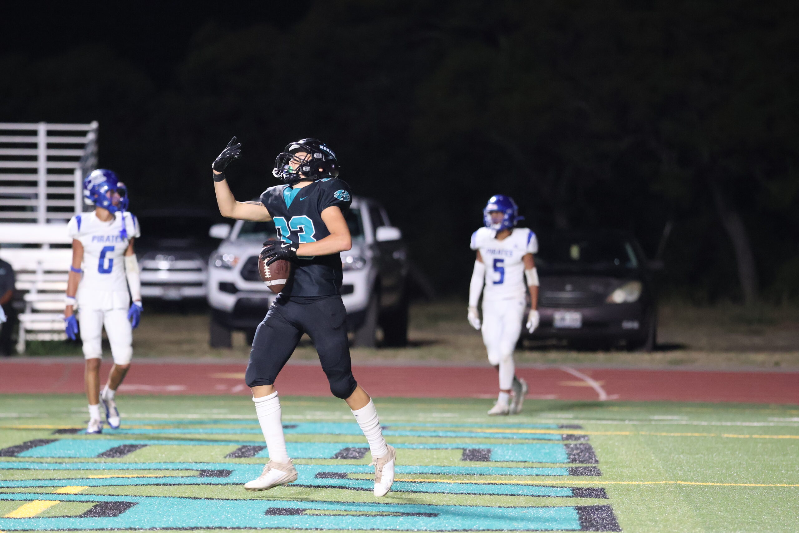 Wayne Kahula of King Kekaulike High School's raises four fingers to symbolize his fourth of five touchdowns on Saturday night in a 68-41 win over Morro Bay, Calif. REID YAMAMOTO photo