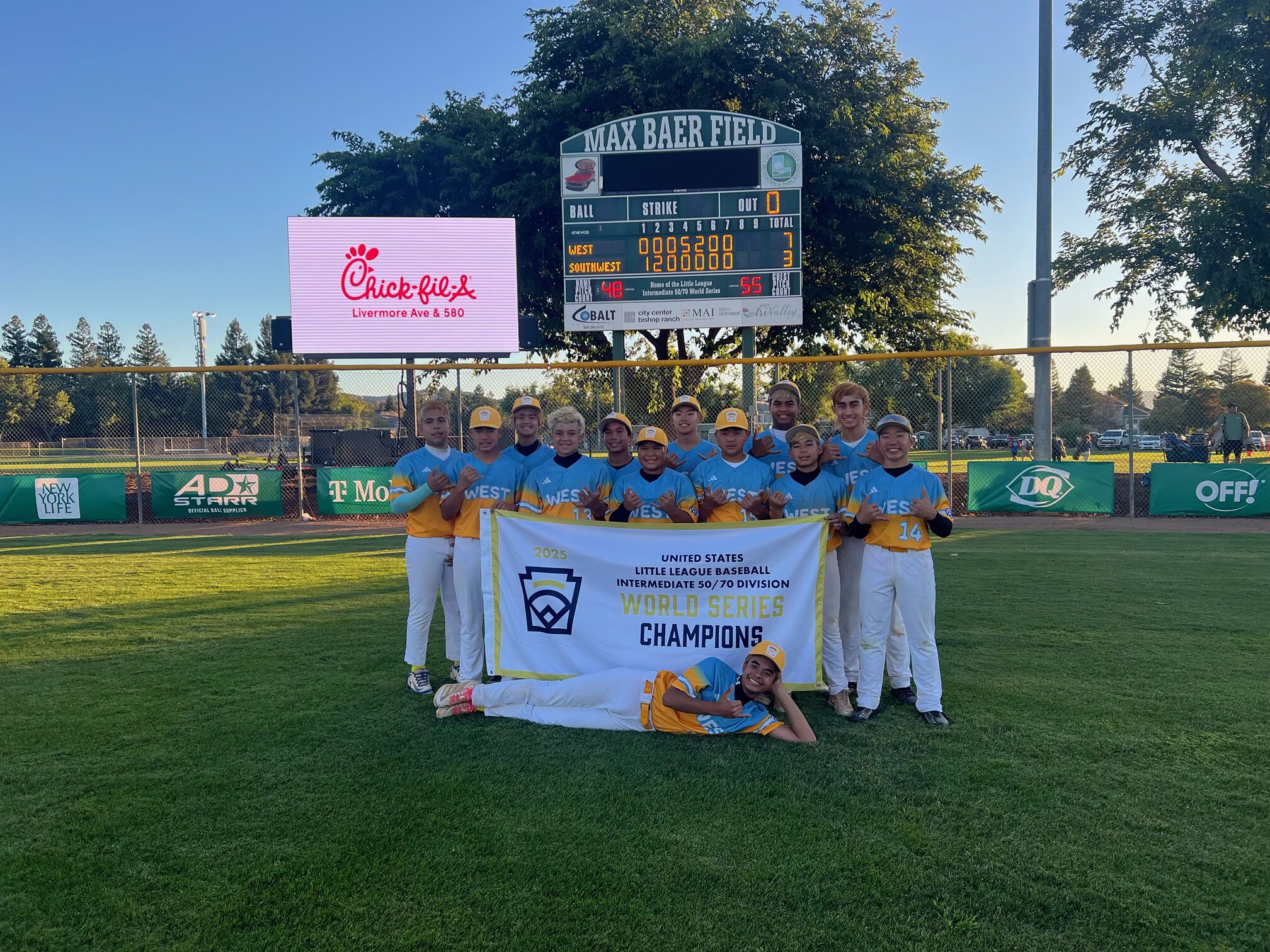 The Central East Maui Little League displays their national championship banner on Saturday after their 7-3 win over Greater New Orleans Little League in the national championship game in Livermore, Calif. Maui will play a team from Venezuela Sunday for the world championship. Courtesy photo
