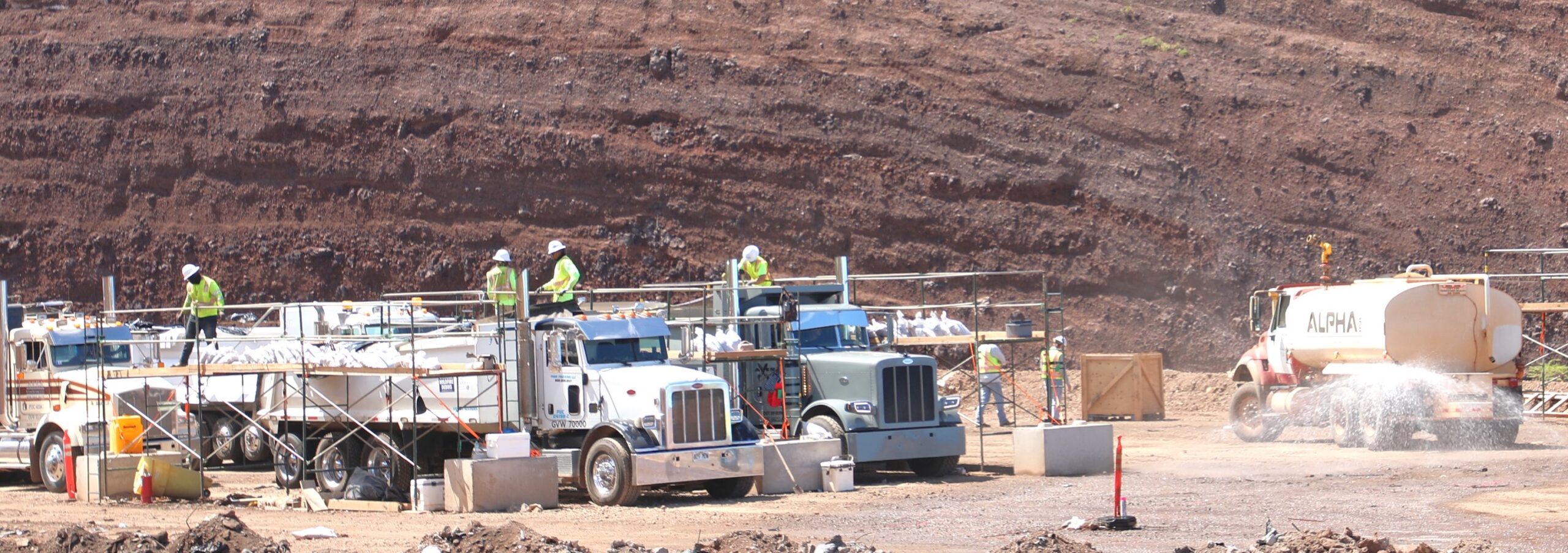 Trucks are loaded at the temporary disposal site where approximately 400,000 tons of debris from the Lahaina wildfire were stored. The U.S. Army Corps of Engineers are more than 50% done with the project to move the debris to the permanent site at the Central Maui landfill. Photo: U.S. Army Corps of Engineers, Honolulu District.
