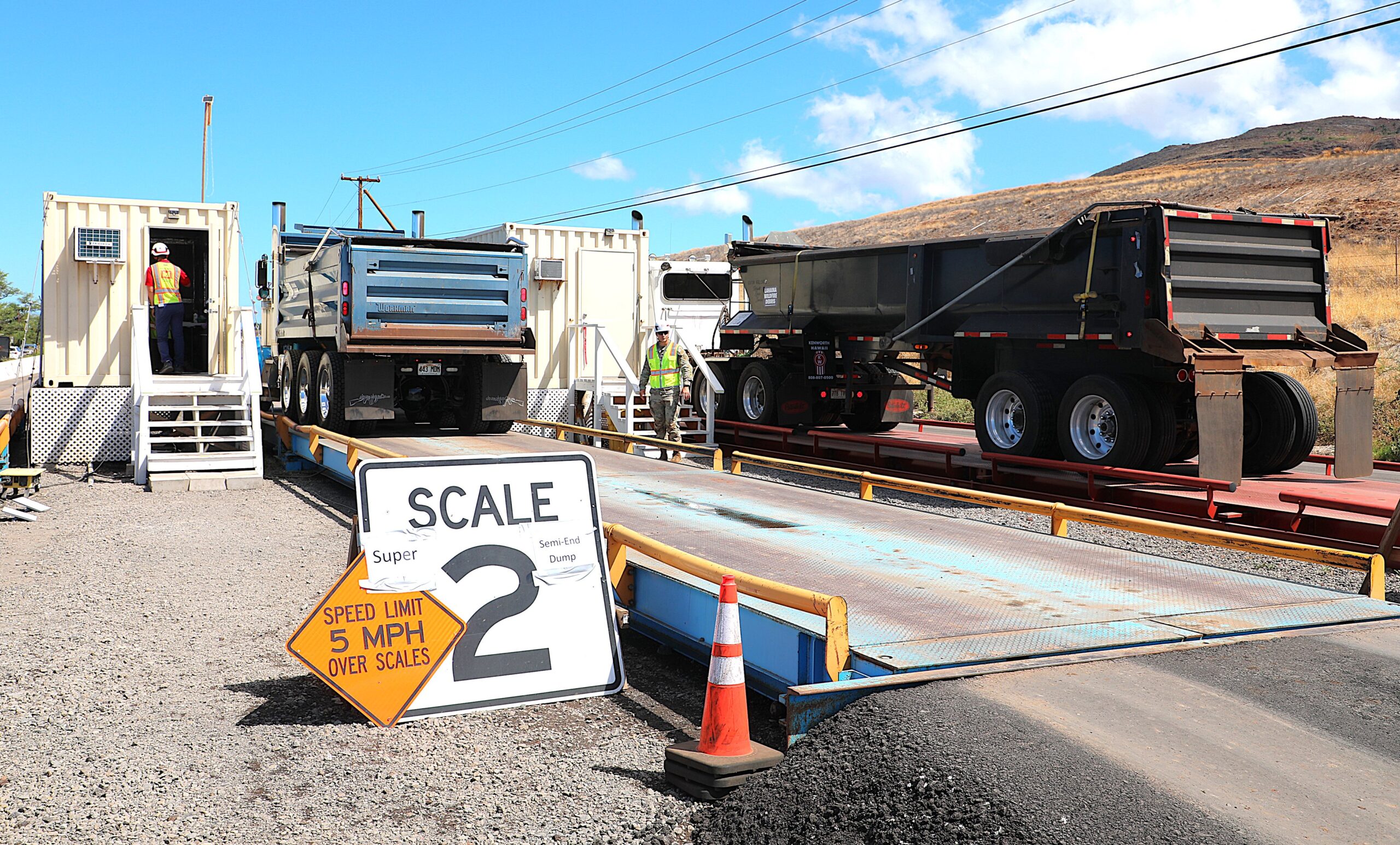 Trucks are weighed as they leave the temporary disposal site where approximately 400,000 tons of debris from the Lahaina wildfire were stored. The U.S. Army Corps of Engineers are more than 50% done with the project to move the debris to the permanent site at the Central Maui landfill. Photo: U.S. Army Corps of Engineers, Honolulu District.