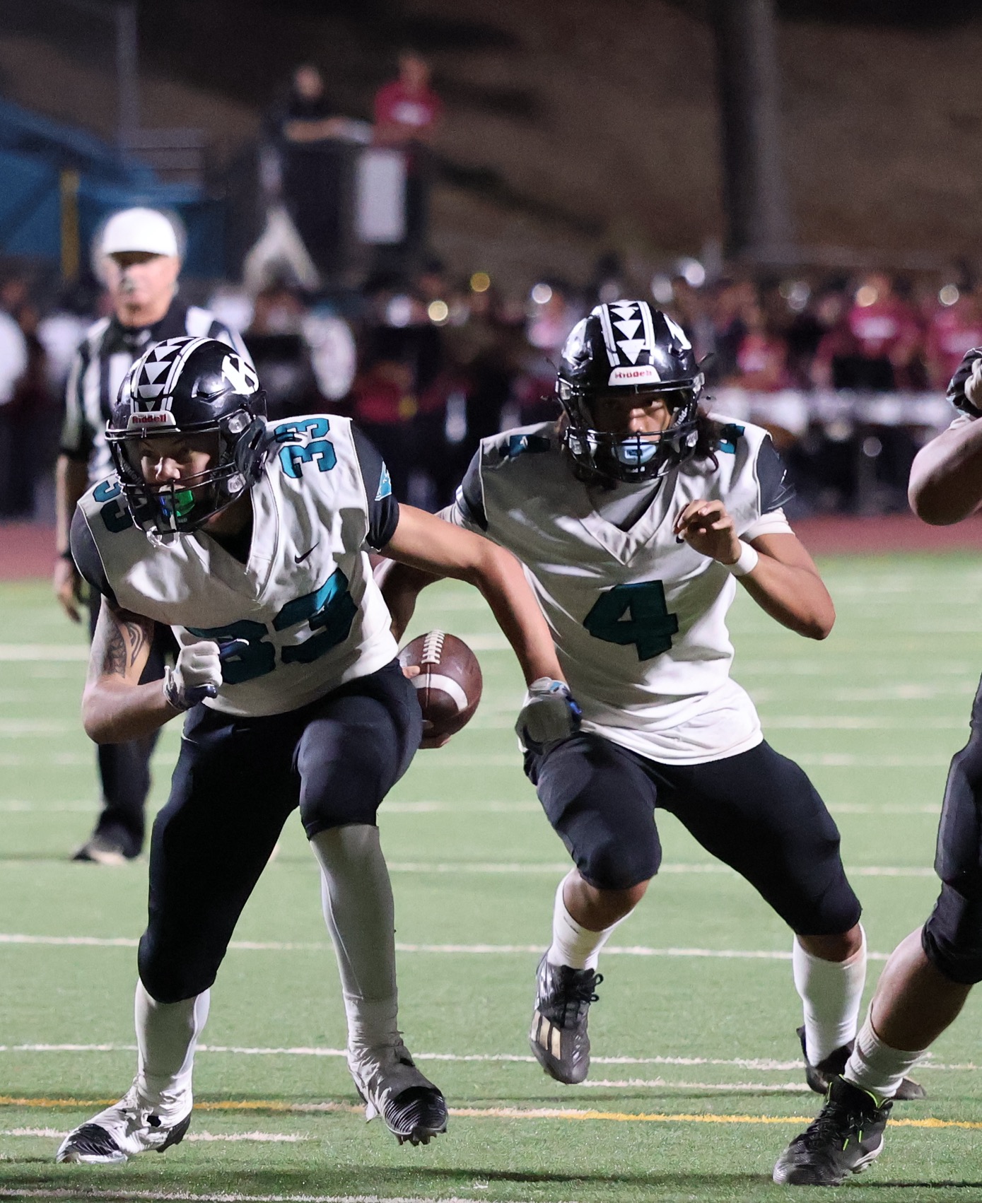 King Kekaulike High School's Wayne Kahula (33) leads the way for fellow running back Kanoa Kuailani in Na Ali'i's 34-28 overtime win over Baldwin on Friday. REID YAMAMOTO photo