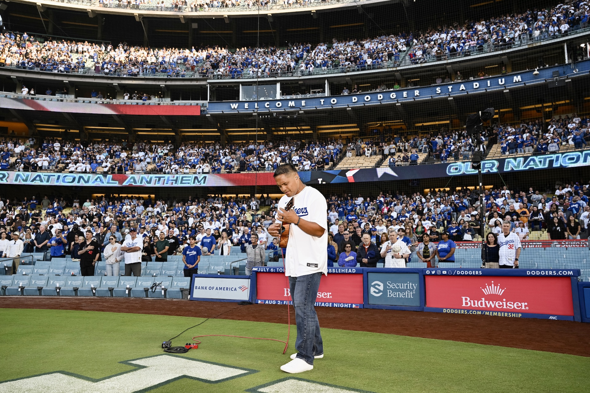 Derick Sebastian, an 'ukulele virtuoso from Maui, is shown here playing the national anthem at Dodger Stadium on July 5, 2023, in a game vs. the Pittsburgh Pirates. Sebastian is set to play The Star-Spangled Banner at Dodger Stadium again today on Shohei Otani bobblehead giveaway day against the Colorado Rockies. Carrie Giordano/Los Angeles Dodgers photo