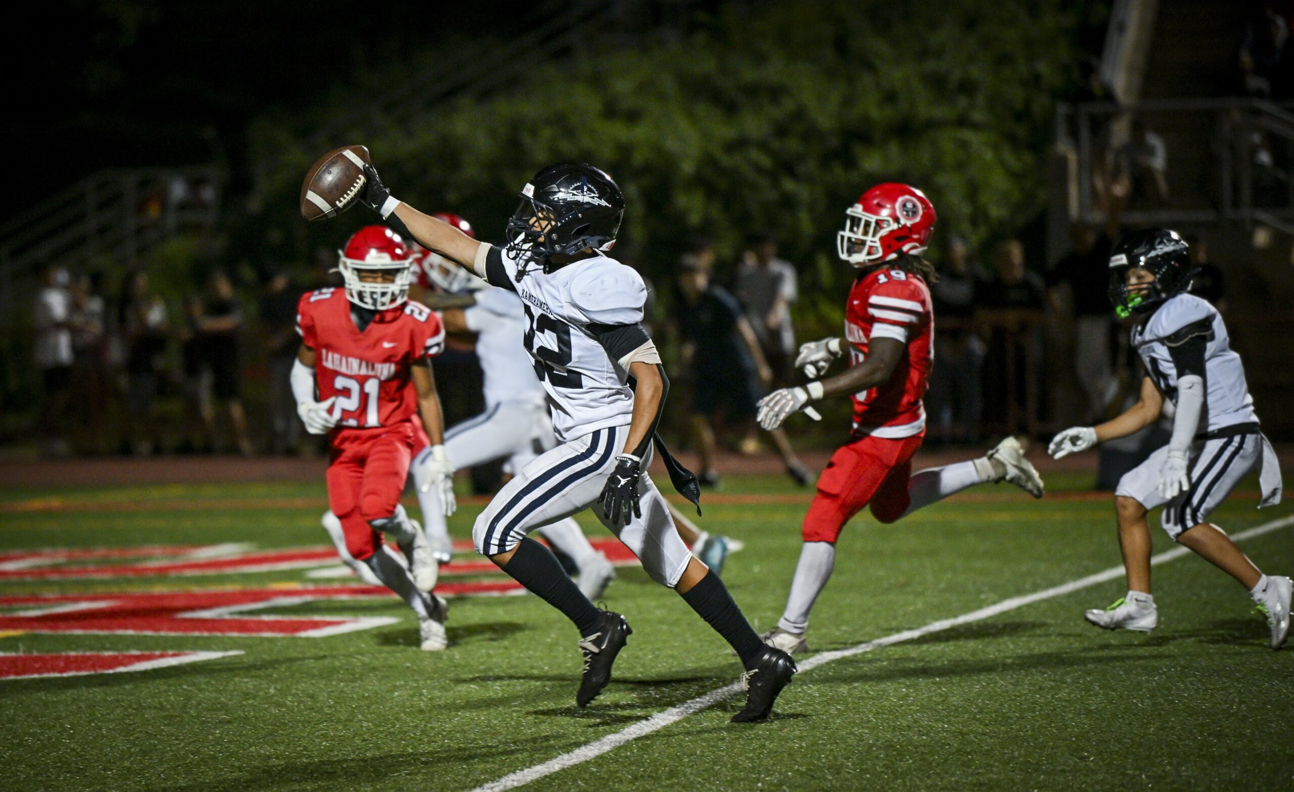 Kamehameha Maui's Zedekaiah Campbell scores one of his two touchdowns on Saturday in a 36-0 win over Lahainaluna at Sue Cooley Stadium. GLEN PASCUAL photo