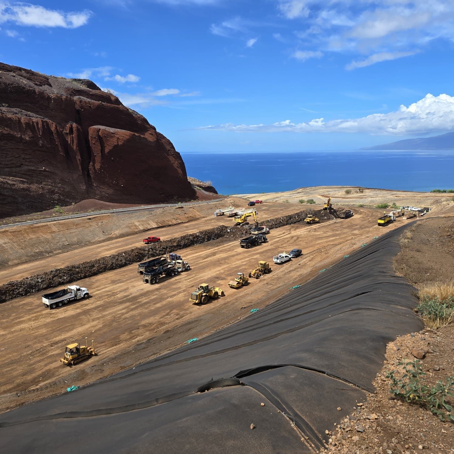 This is a view of trucks rolling out of the Temporary Disposal Site in Olowalu. The Olowalu site is expected to be closed out by the end of 2025. U.S. Army Corps of Engineers photo