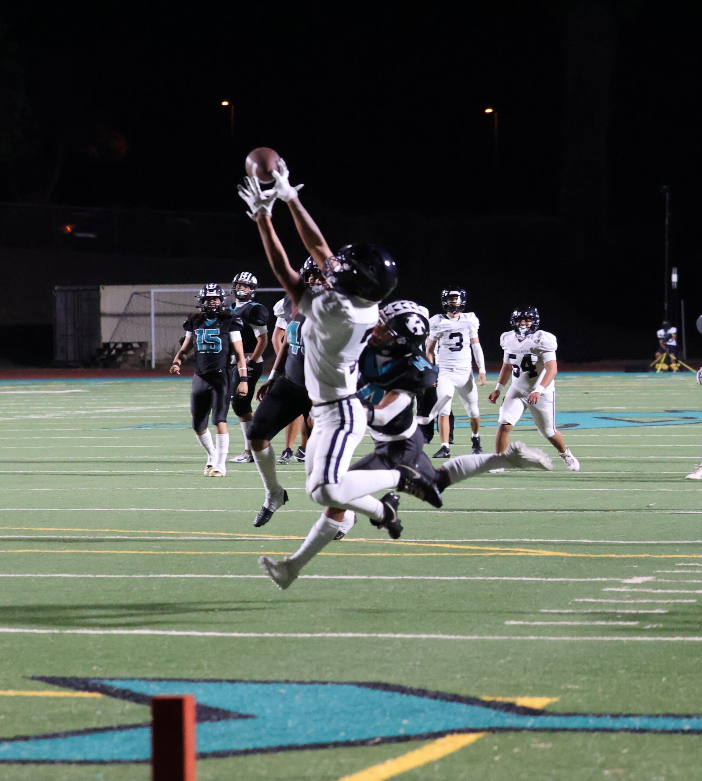 Kamehameha Schools Maui's Loea Asuega-Stark hauls in a 21-yard touchdown pass from Kekoa Keau-Davis in the Warriors' 41-7 win over King Kekaulike at King Kekaulike Stadium on Friday. REID YAMAMOTO photo
