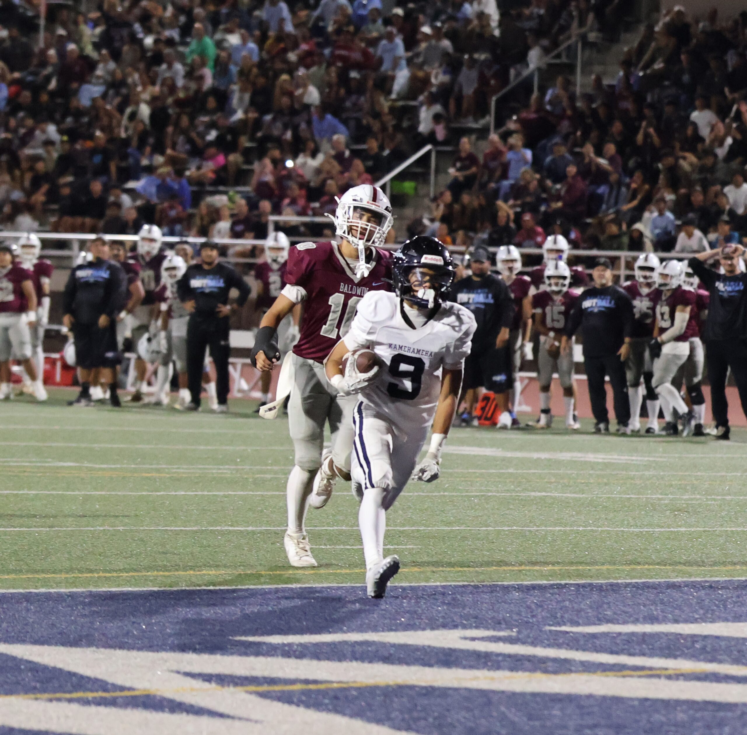 Kamehameha Maui's Bruce Beltran scores a touchdown in the Warriors' 49-28 win over Baldwin on Friday. REID YAMAMOTO photo