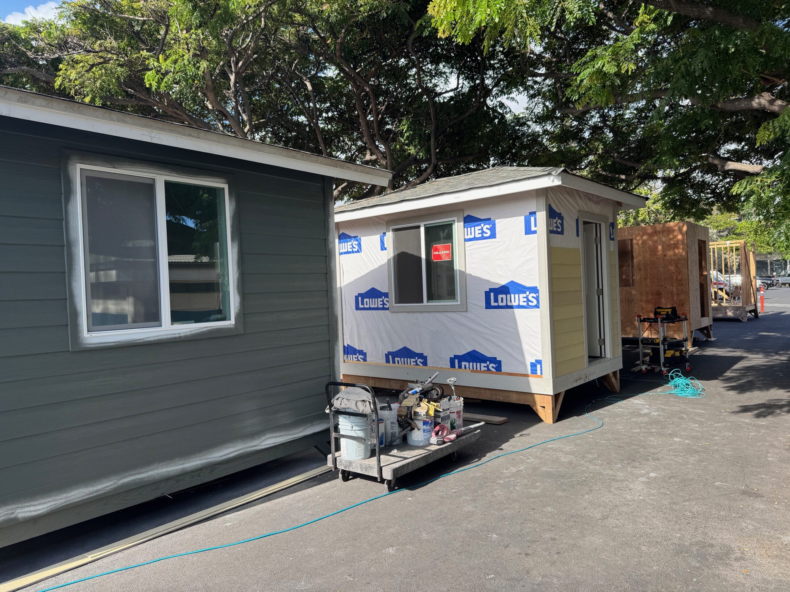 This shot shows four phases of sheds being made at the University of Hawai'i Maui College for Lahaina fire survivors. HJI / ROB COLLIAS photo