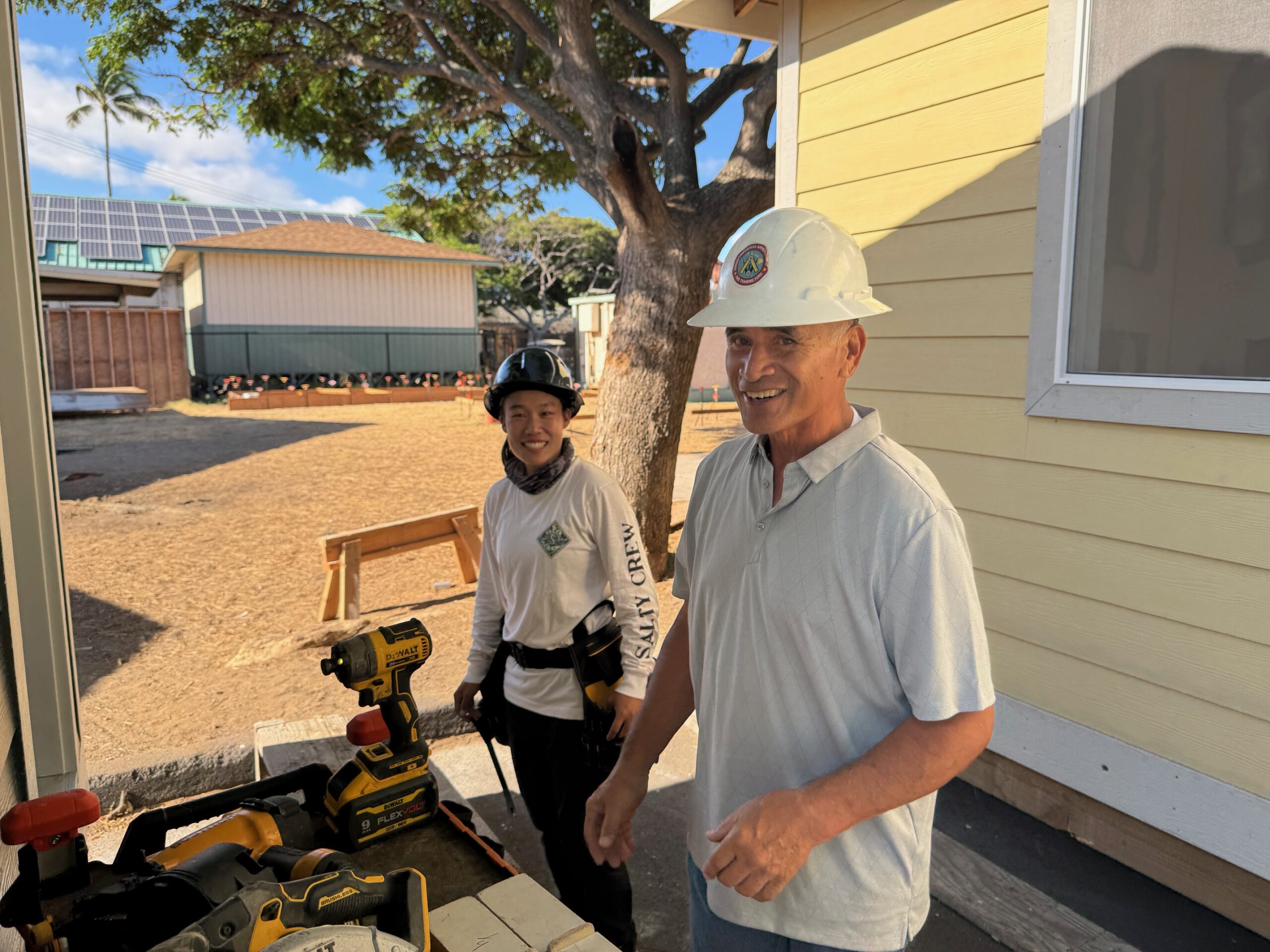 Tiera Arakawa and Ralph Canto work on one of the sheds being built at the University of Hawai'i Maui College on Thursday. HJI / ROB COLLIAS photo