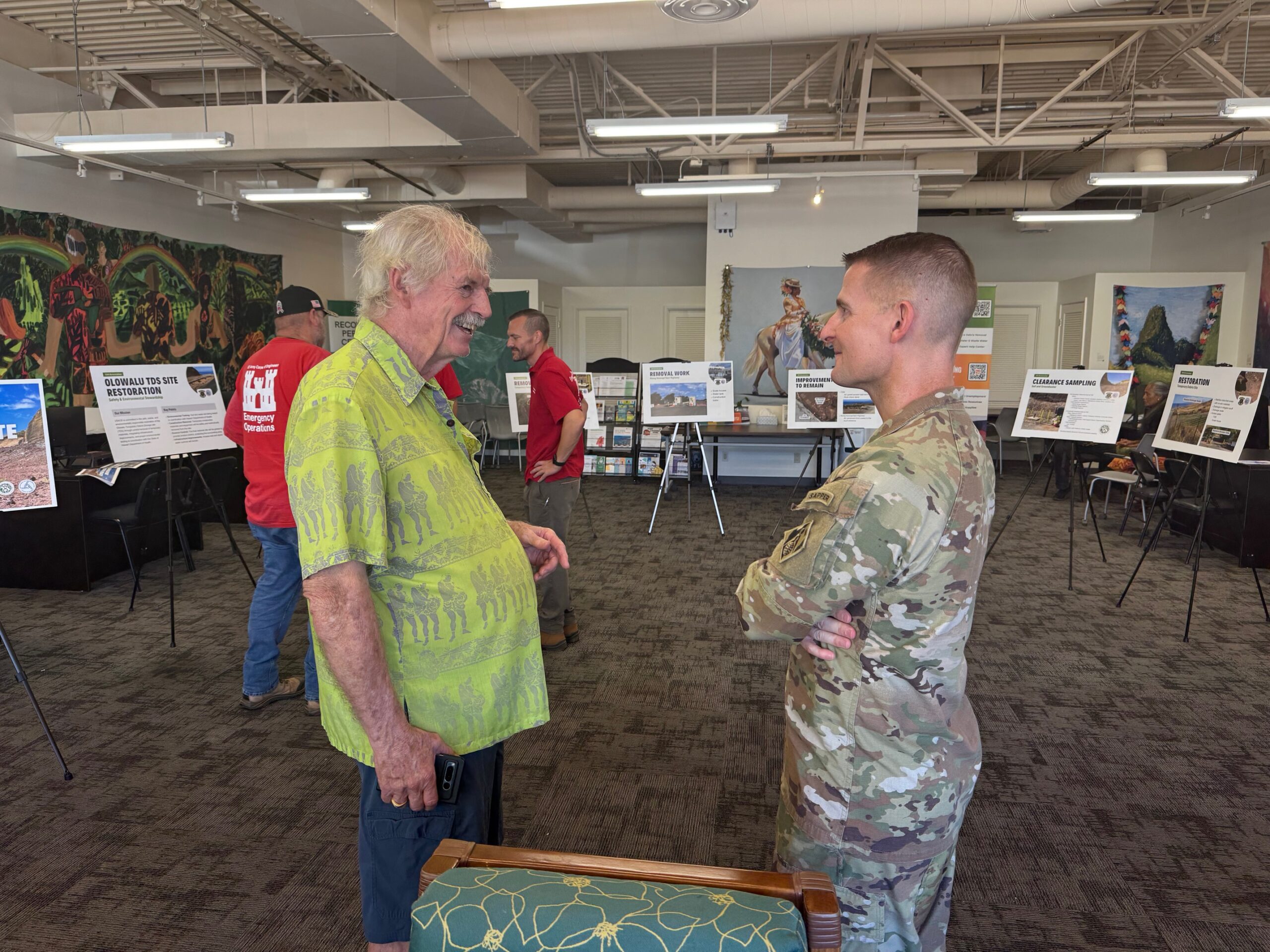 Chuck Clarke (left), an 83-year-old Lahaina resident, speaks with Adrian Biggerstaff, the U.S. Corps of Engineers Honolulu District Commander, at Saturday's open house. HJI / ROB COLLIAS photo