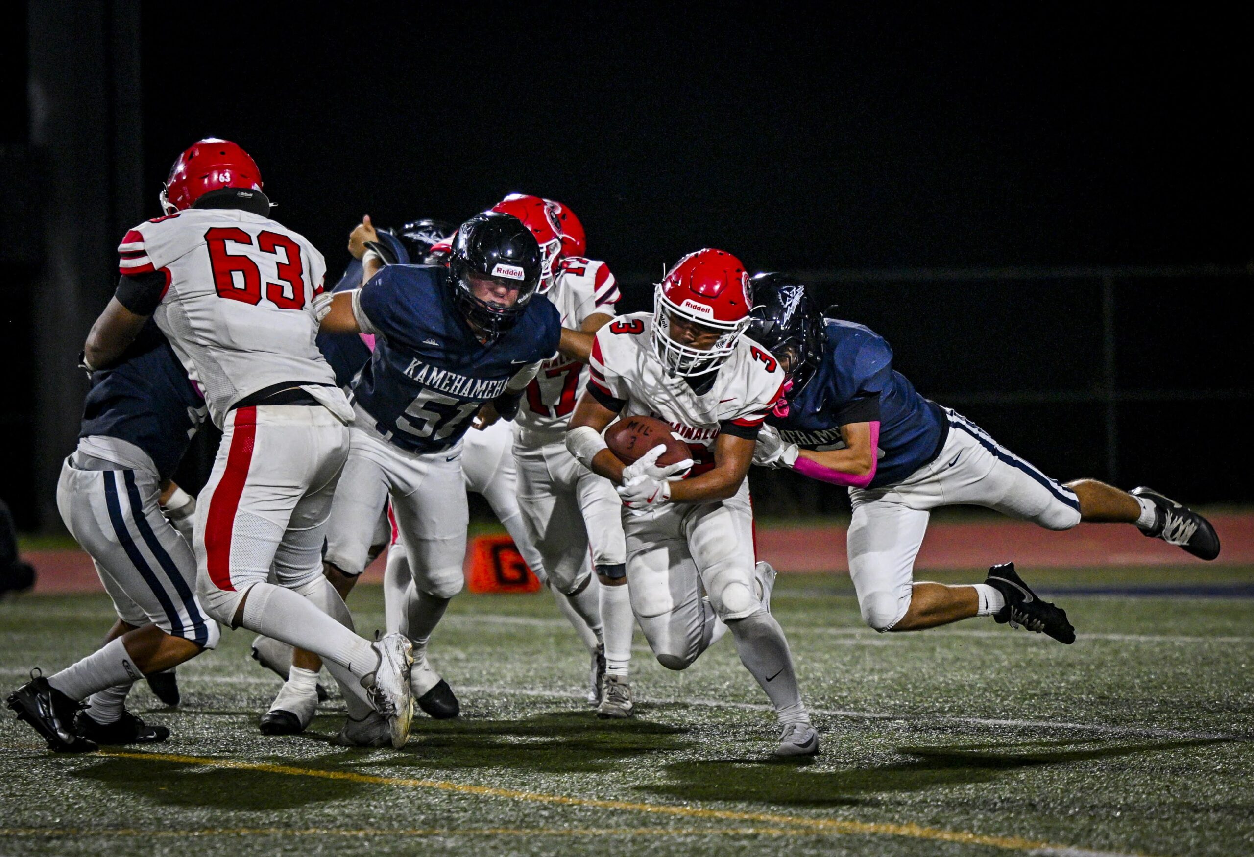 Lahainaluna High School's Joseph Arcangel carries the ball in the Lunas' 27-7 loss to Kamehameha Maui on Friday night at Kanaiaupuni Stadium. GLEN PASCUAL photo