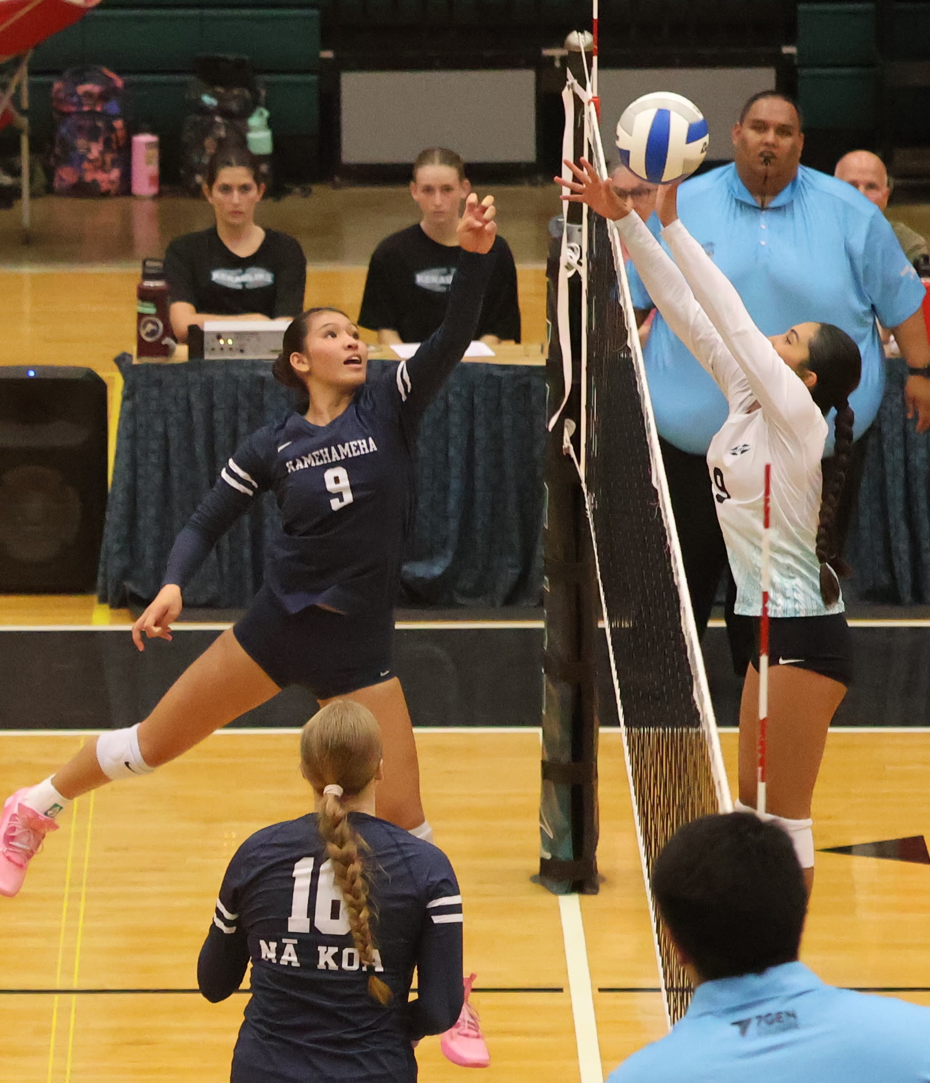 Kamehameha Schools Maui's U'ilani Ahana (left) jousts with King Kekaulike's Nanea Kealoha during the Warriors' 25-12, 25-20, 26-24 win over Na Ali'i on Tuesday at the King Kekaulike Gym. REID YAMAMOTO photo