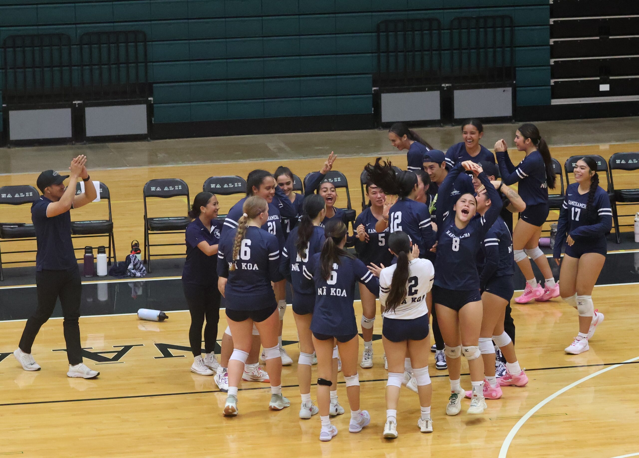 The Kamehameha Schools Maui girls volleyball team celebrates during its 25-12, 25-20, 26-24 win over King Kekaulike at King Kekaulike Gym on Tuesday. The victory clinched the Maui Interscholastic League regular-season title and the state tournament berth that goes with it for the Warriors. HJI / REID YAMAMOTO photo