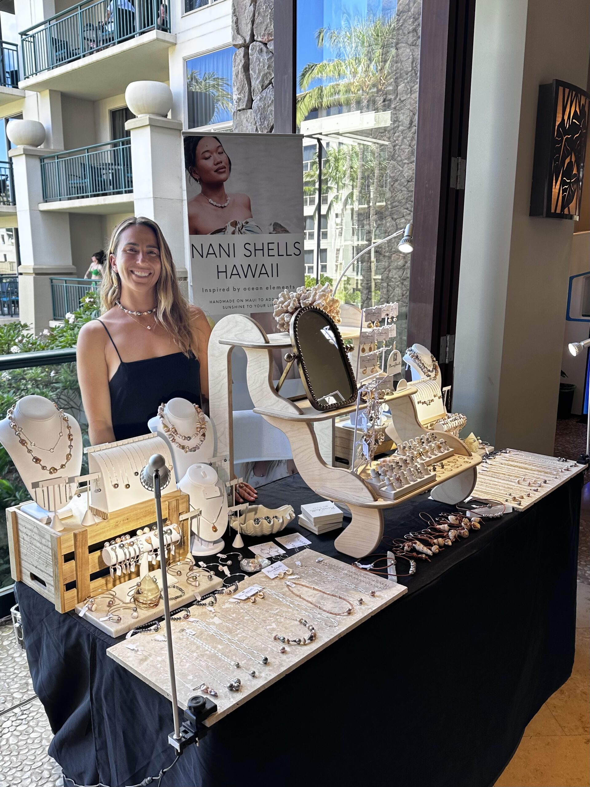 Natasha Porreca shows off her merchandise from Nani Shells jewelry Ka'anapali Ocean Resort in this photo taken in August. Nani Shells does pop-up shows at the Ka'anapali Ocean Resort every Sunday. Courtesy photo